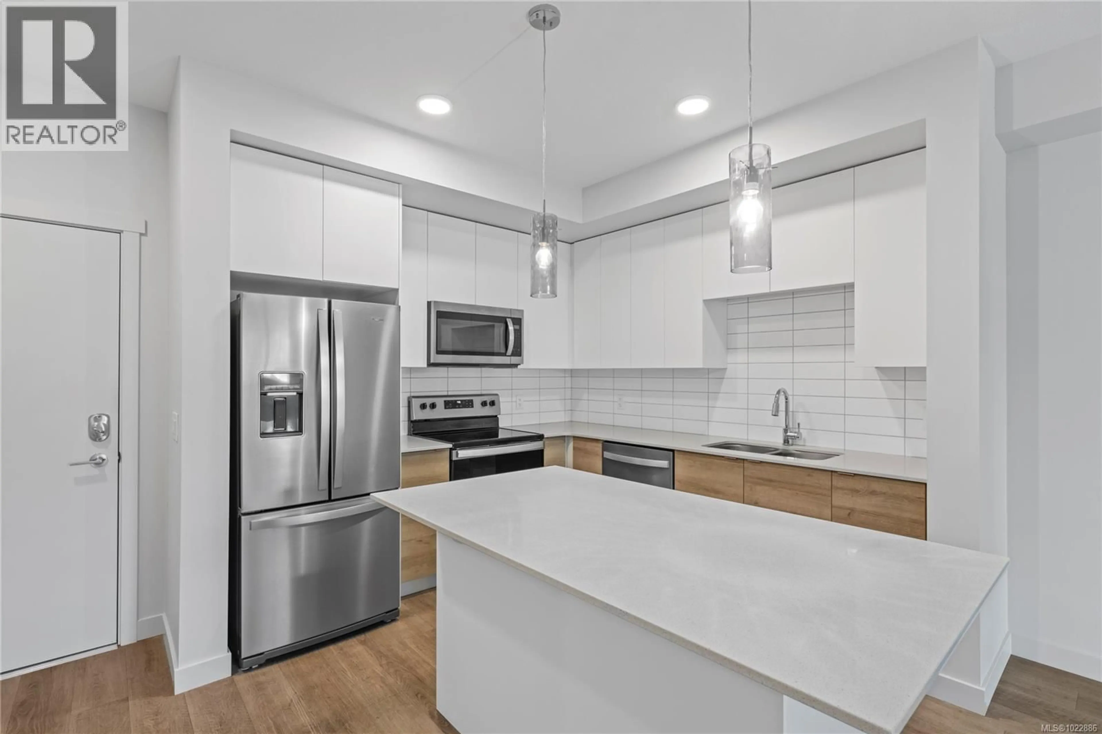 Open concept kitchen, ceramic/tile floor for 218 - 4830 CEDAR RIDGE PLACE, Nanaimo British Columbia V9T0M8