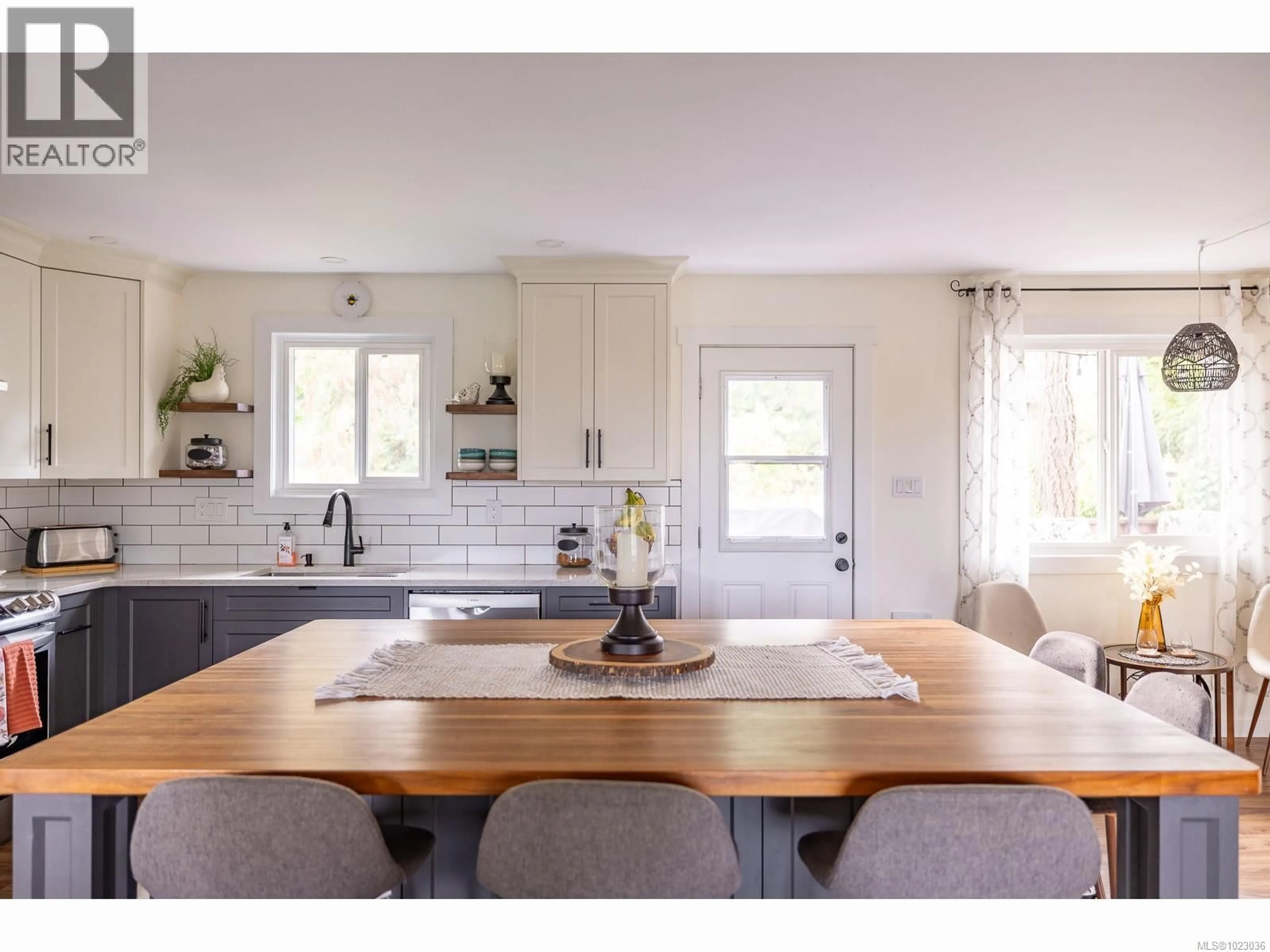 Open concept kitchen, wood/laminate floor for 7485 FERNMAR ROAD, Lantzville British Columbia V0R2H0