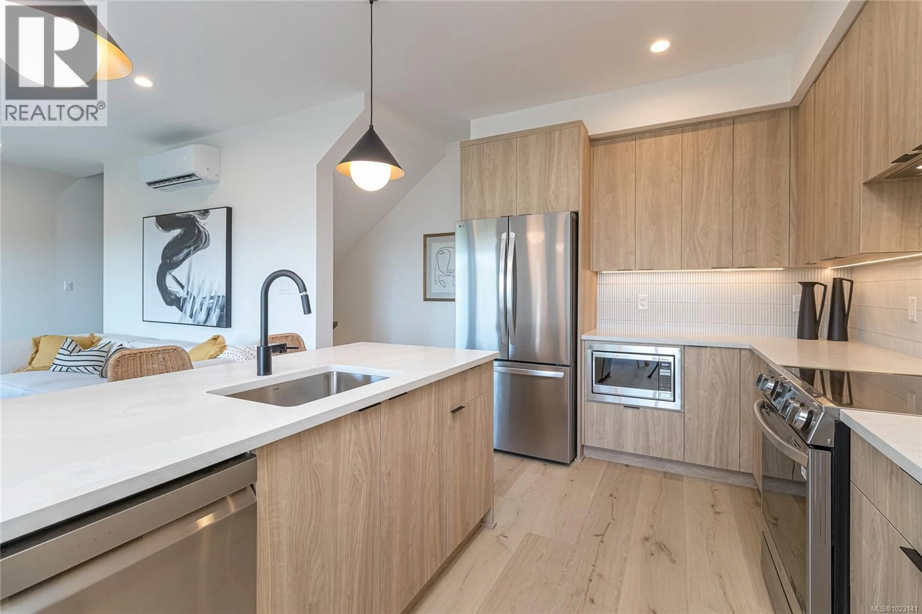 Open concept kitchen, wood/laminate floor for 1410 DOLOMITE RIDGE, Langford British Columbia V9B7G1