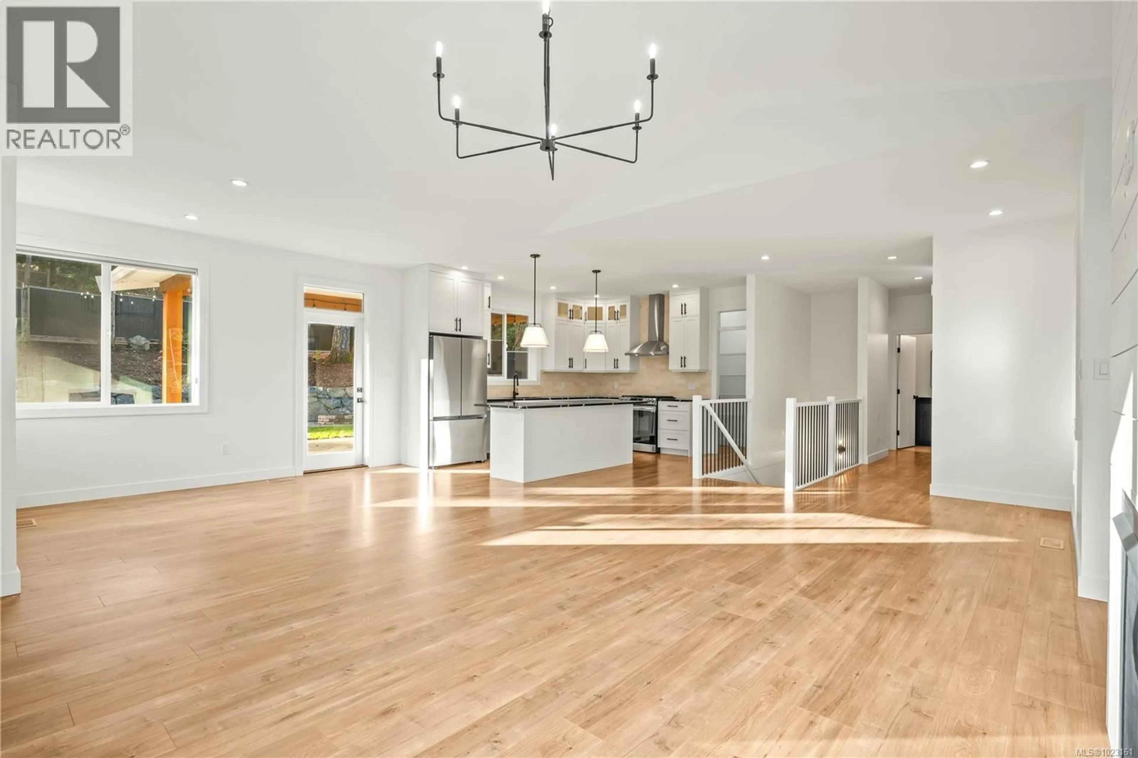 Open concept kitchen, wood/laminate floor for 7227 AULDS ROAD, Lantzville British Columbia V0R2H0