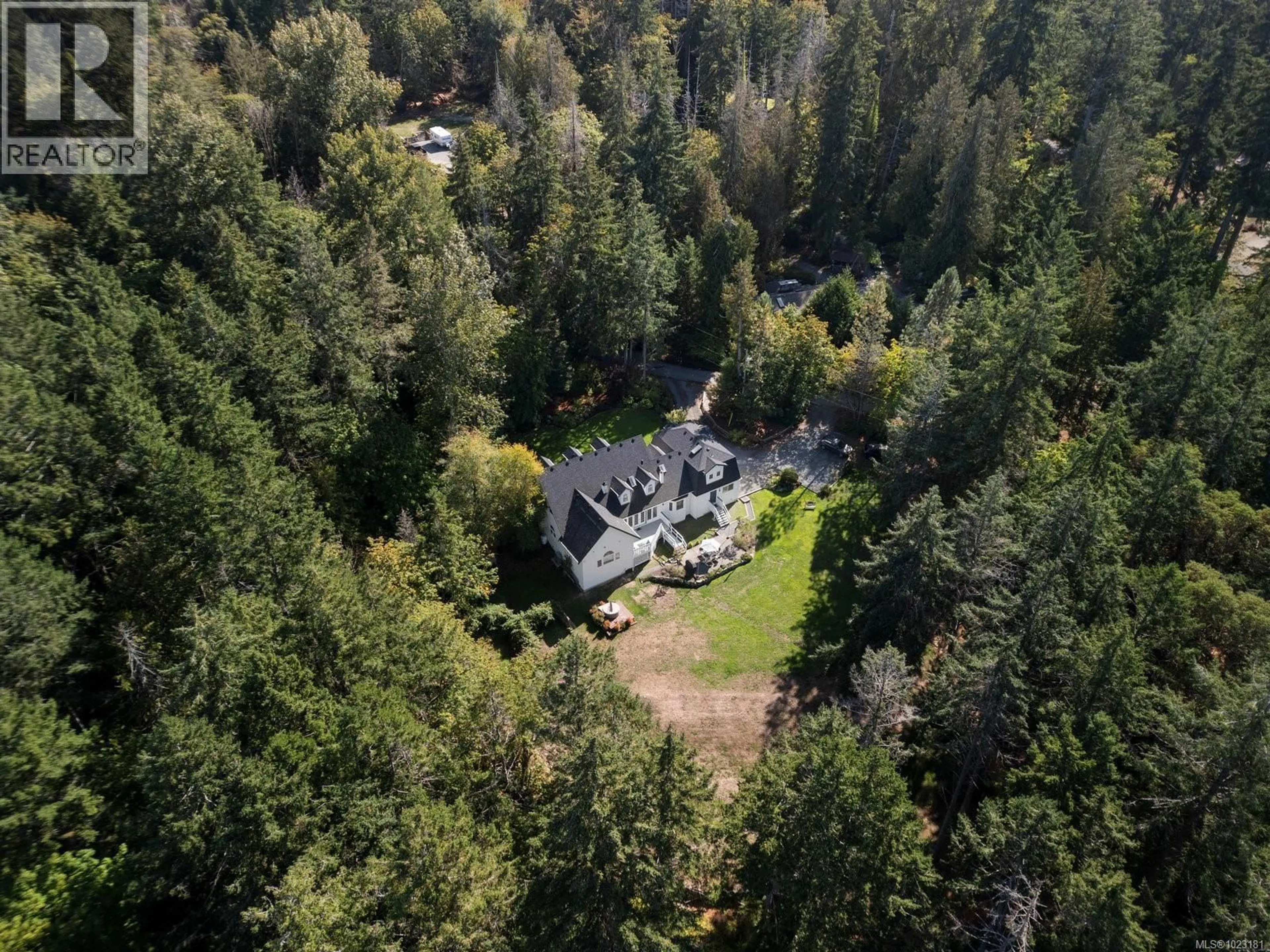 A pic from outside/outdoor area/front of a property/back of a property/a pic from drone, forest/trees view for 560 SALMON ROAD, North Saanich British Columbia V8M1S5