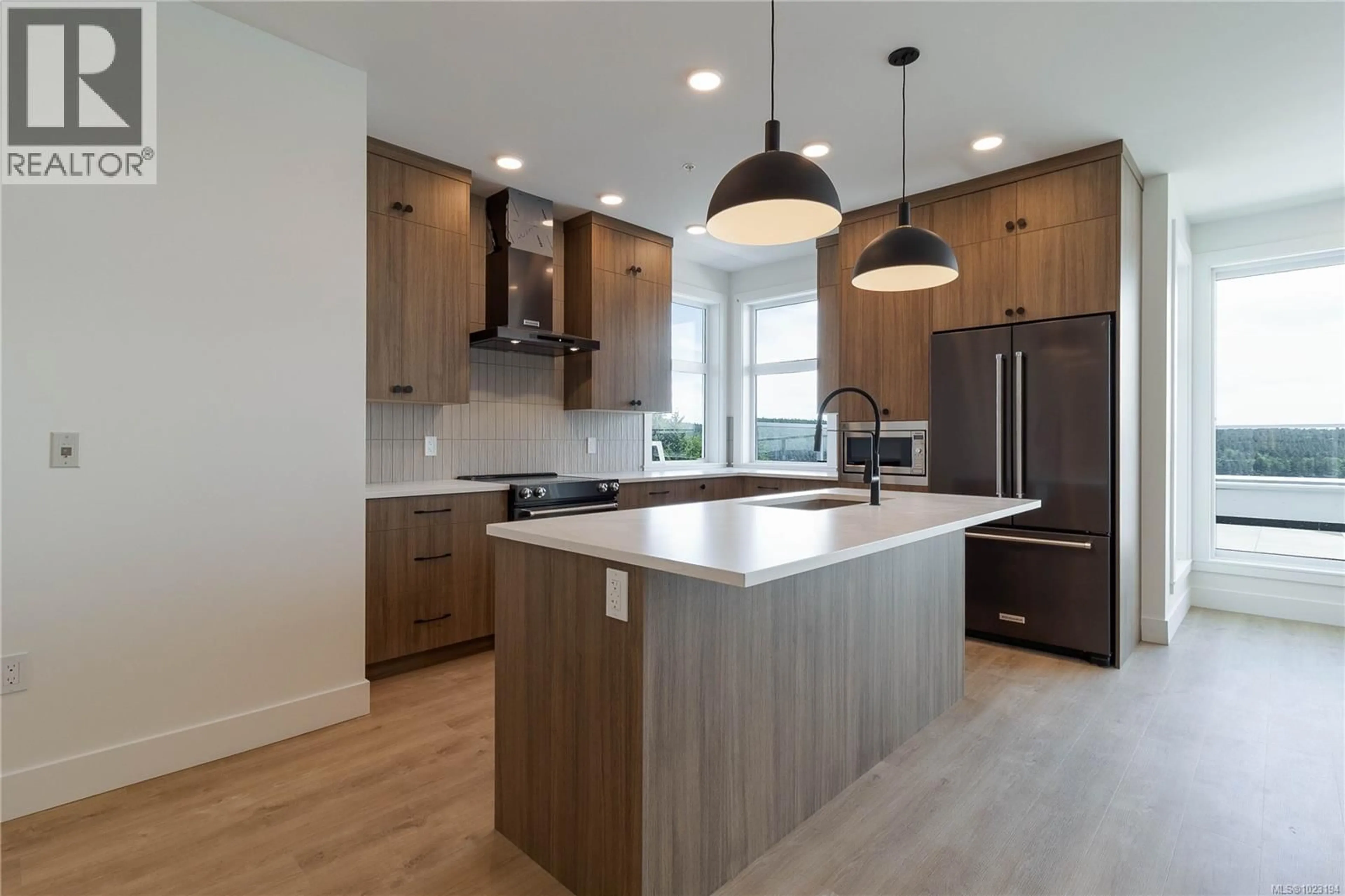 Open concept kitchen, wood/laminate floor for 502 - 201 DOGWOOD DRIVE, Ladysmith British Columbia V9G0C3