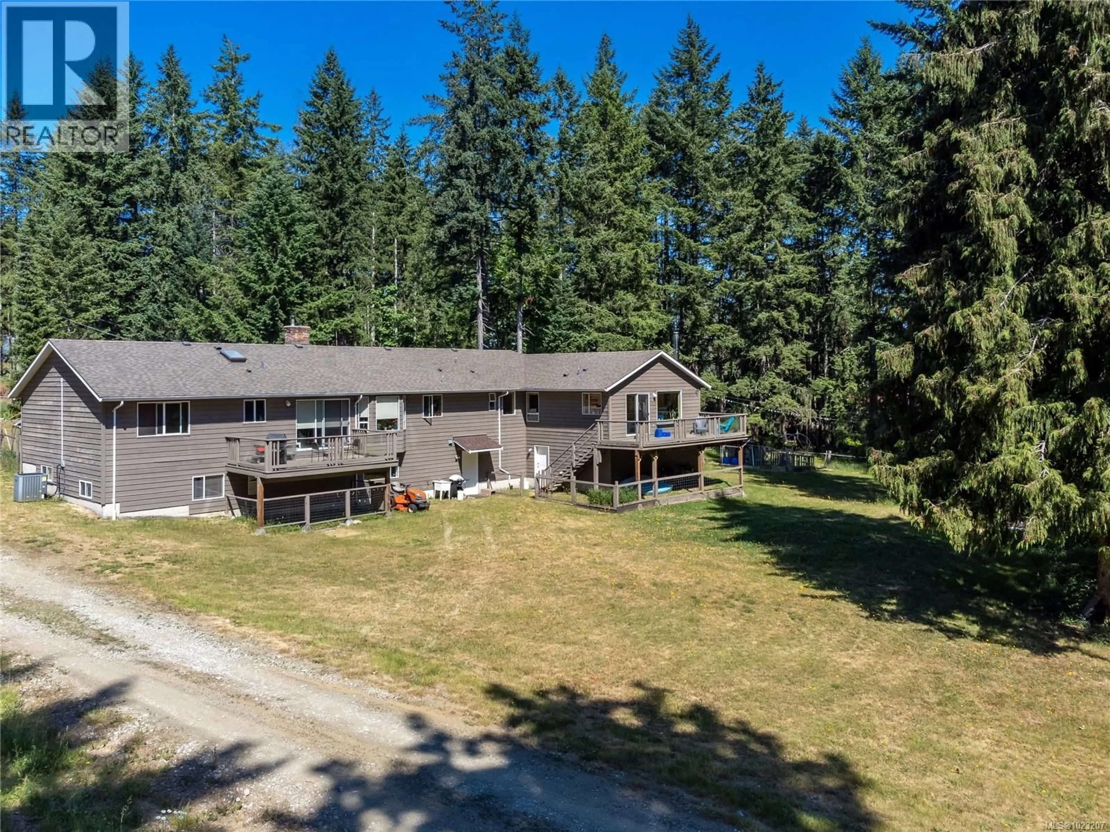 A pic from outside/outdoor area/front of a property/back of a property/a pic from drone, forest/trees view for 8598 ISLAND HIGHWAY NORTH, Black Creek British Columbia V9N1H3