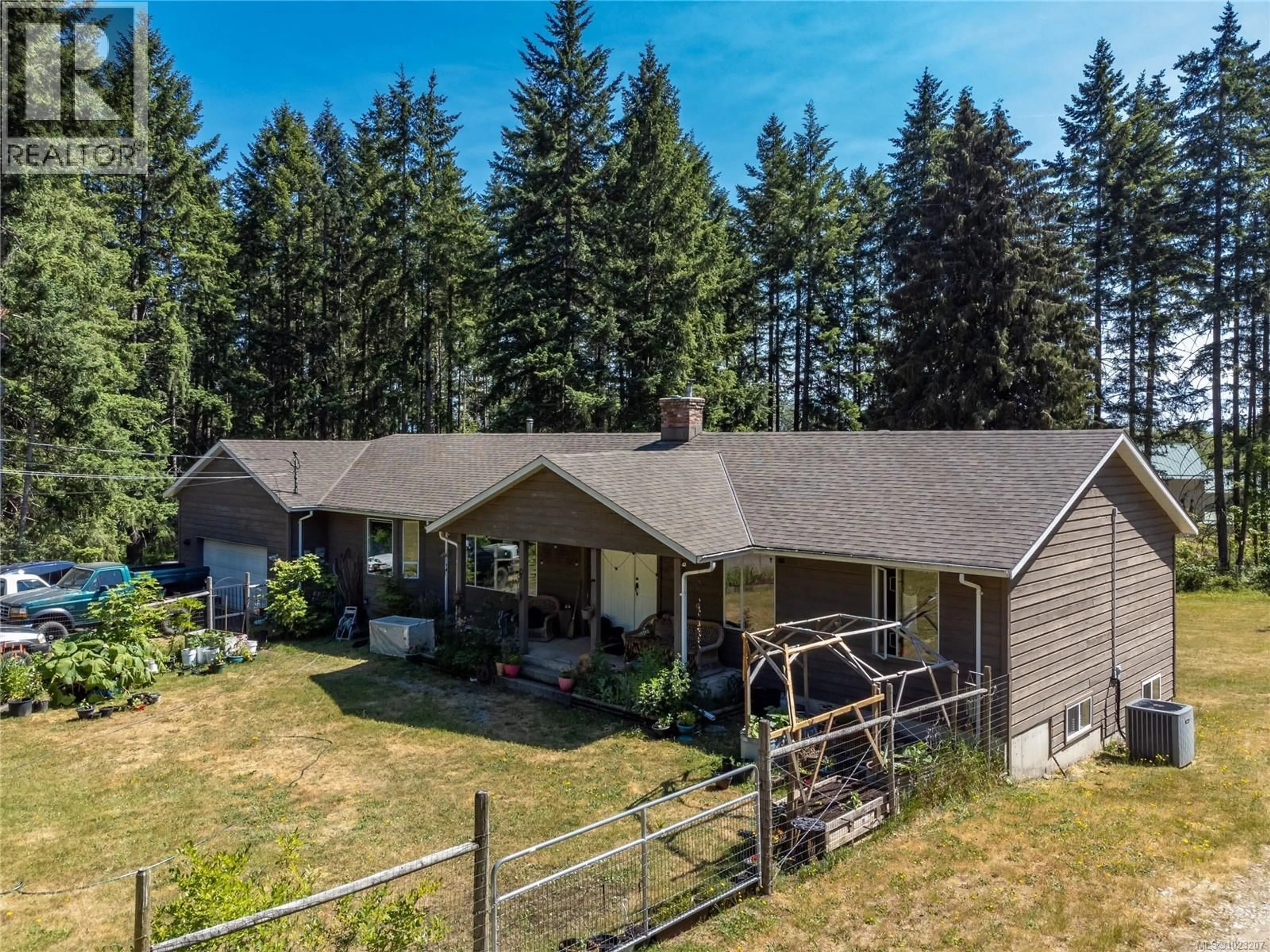 A pic from outside/outdoor area/front of a property/back of a property/a pic from drone, mountain view for 8598 ISLAND HIGHWAY NORTH, Black Creek British Columbia V9N1H3