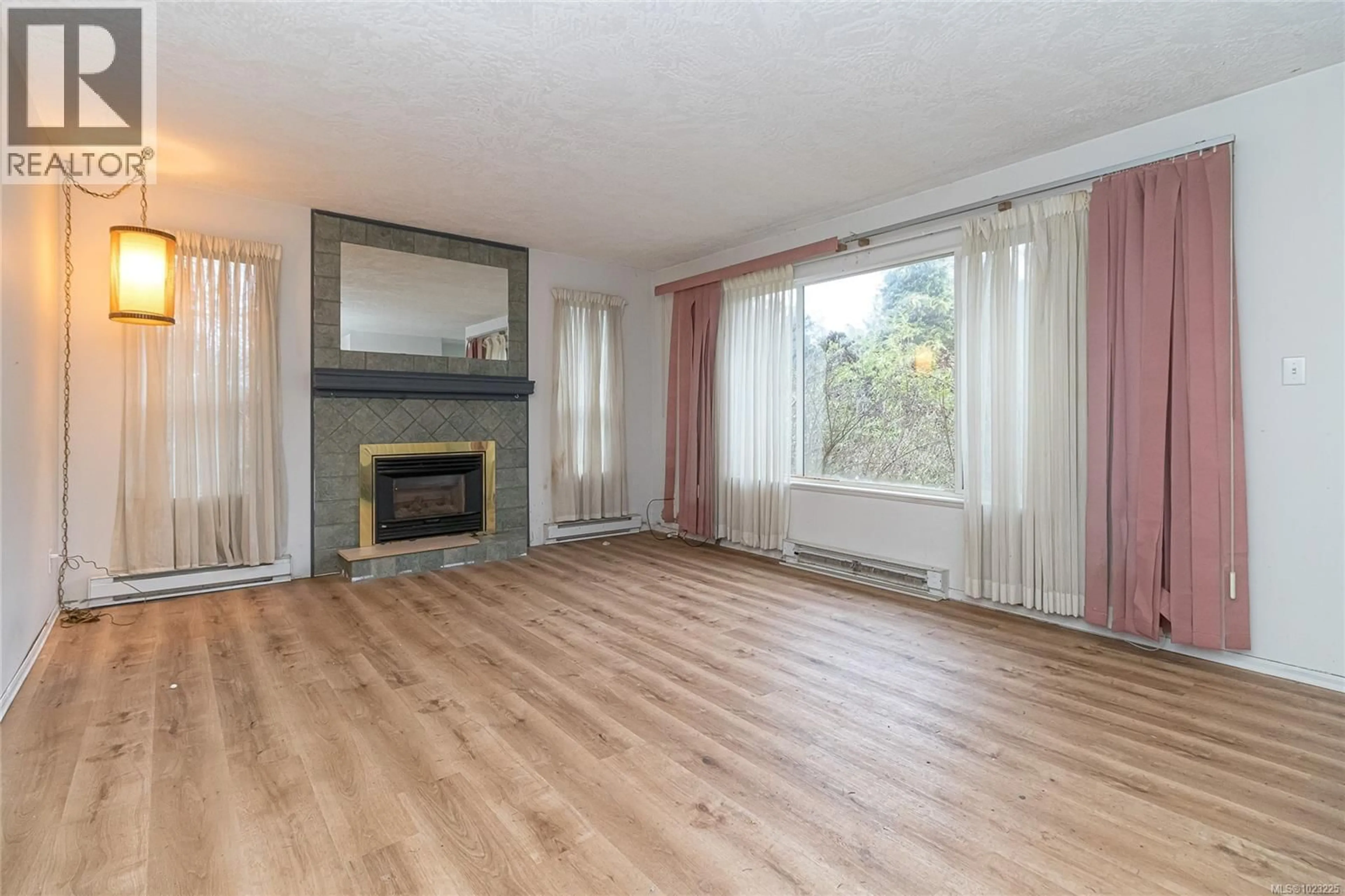 Living room with furniture, wood/laminate floor for A & B - 706 DONOVAN AVENUE, Colwood British Columbia V9B2A3