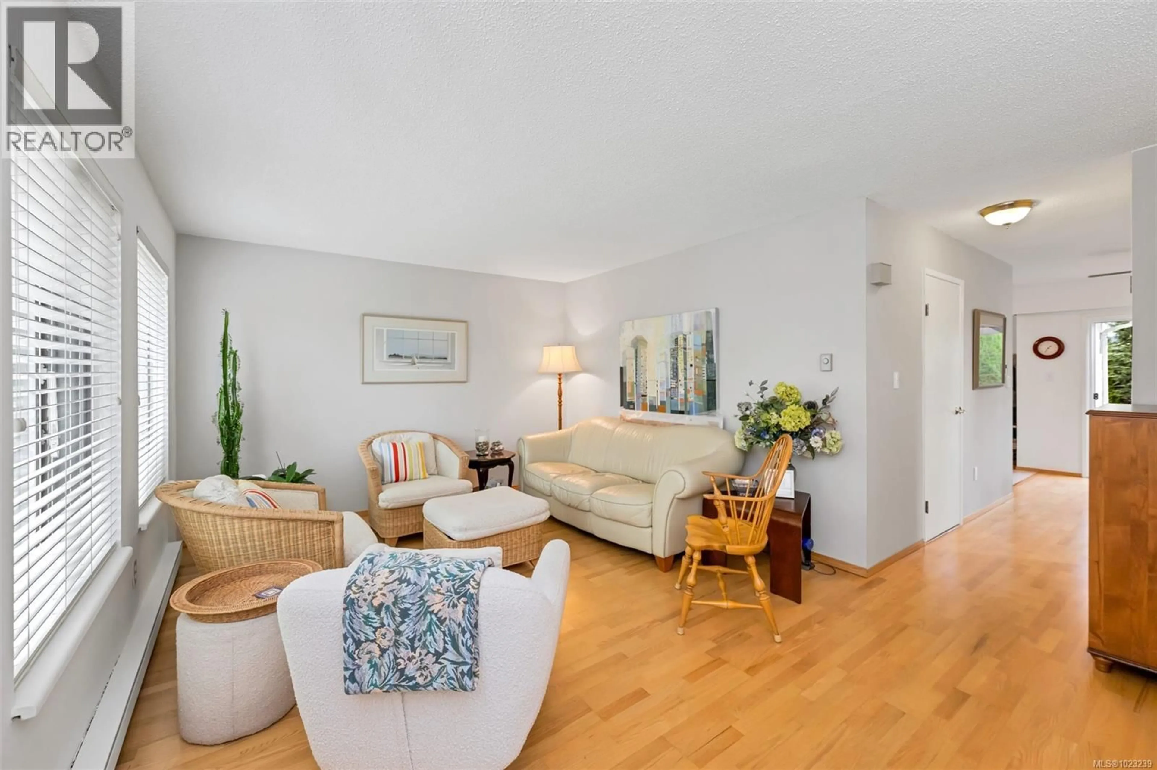 Living room with furniture, wood/laminate floor for 12 - 1741 MCKENZIE AVENUE, Saanich British Columbia V8N1A6
