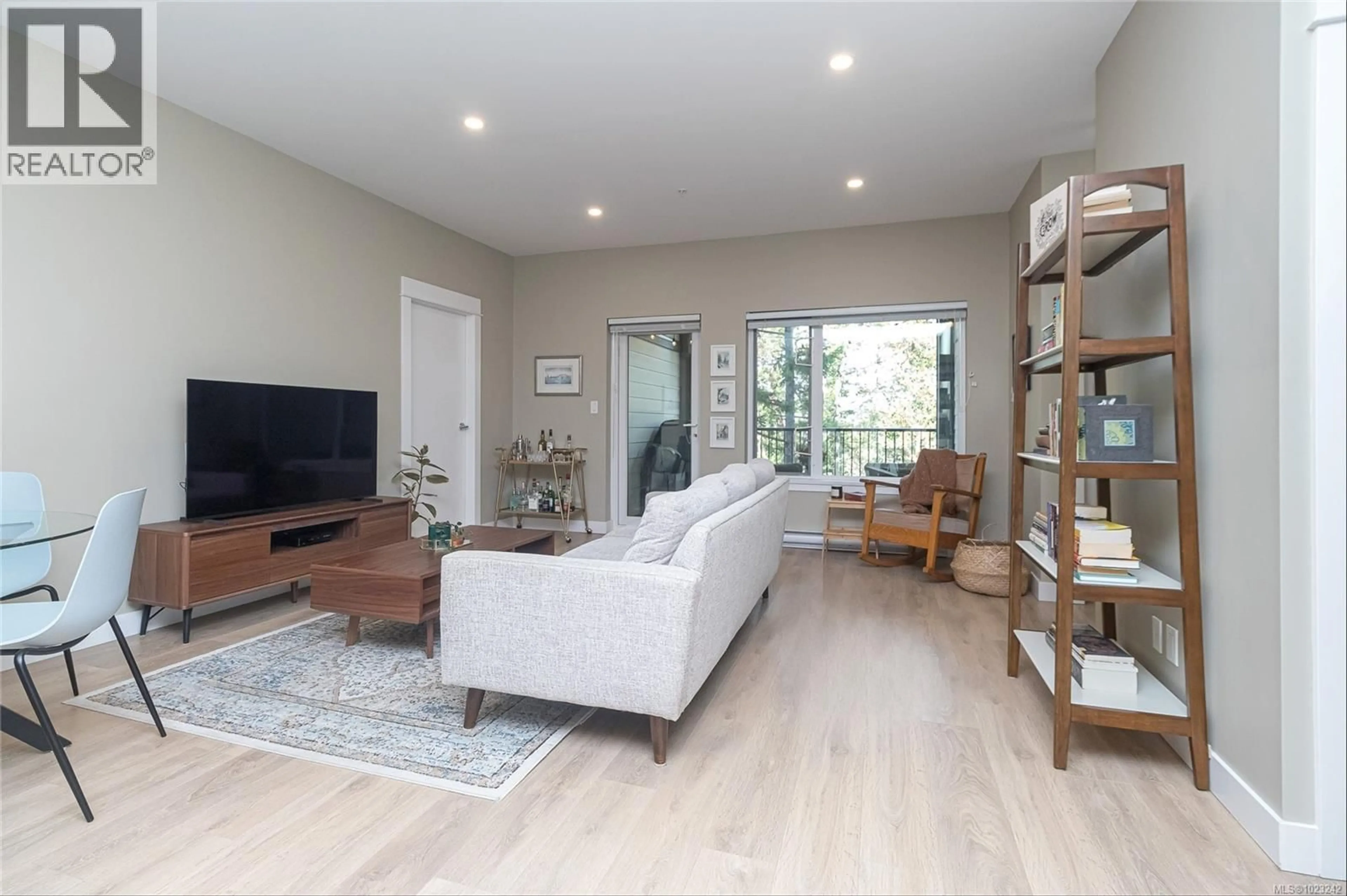 Living room with furniture, wood/laminate floor for 303 - 290 WILFERT ROAD, View Royal British Columbia V9C0H6