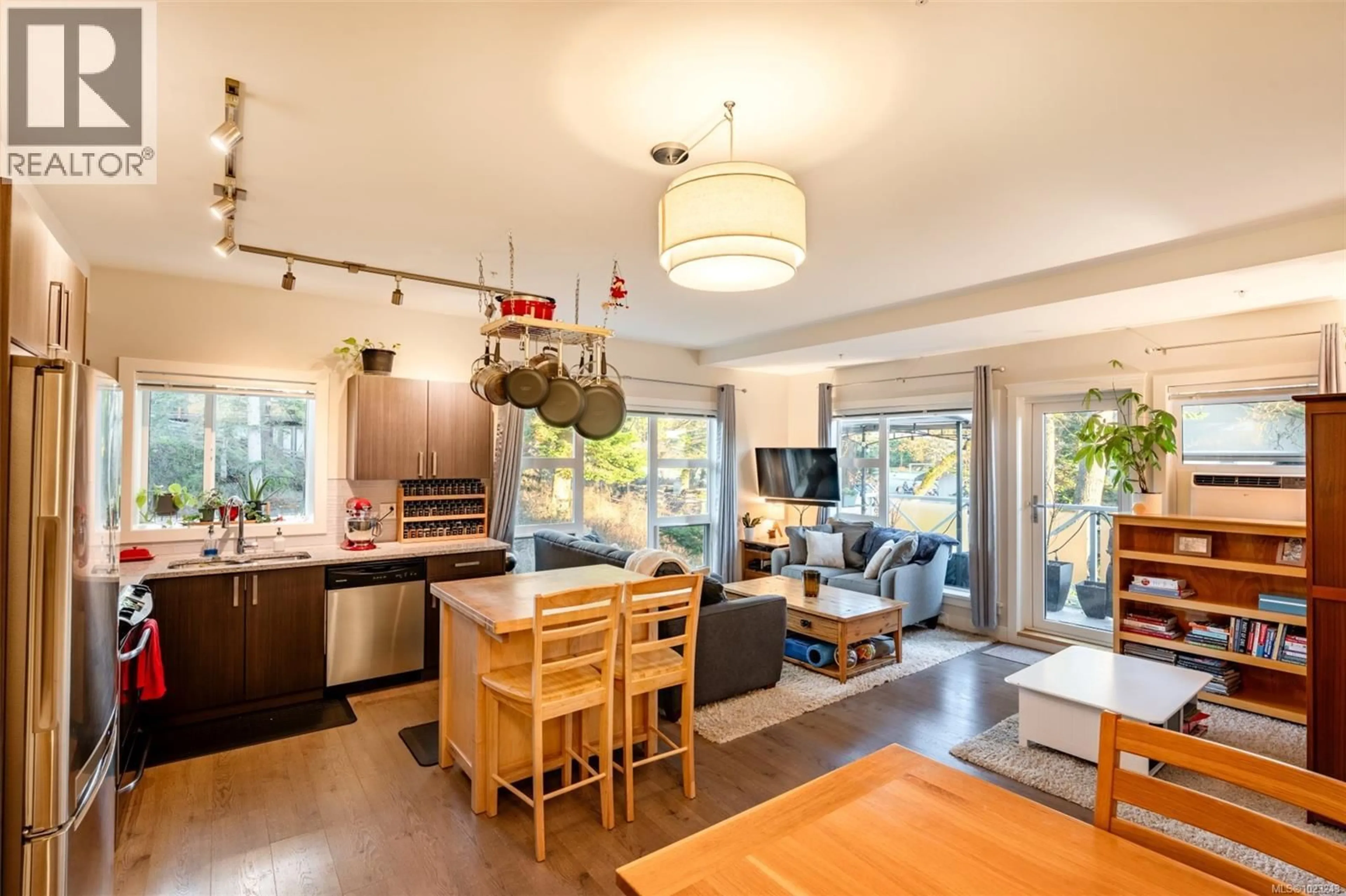 Open concept kitchen, wood/laminate floor for 208 - 1900 WATKISS WAY, View Royal British Columbia V9B0B6