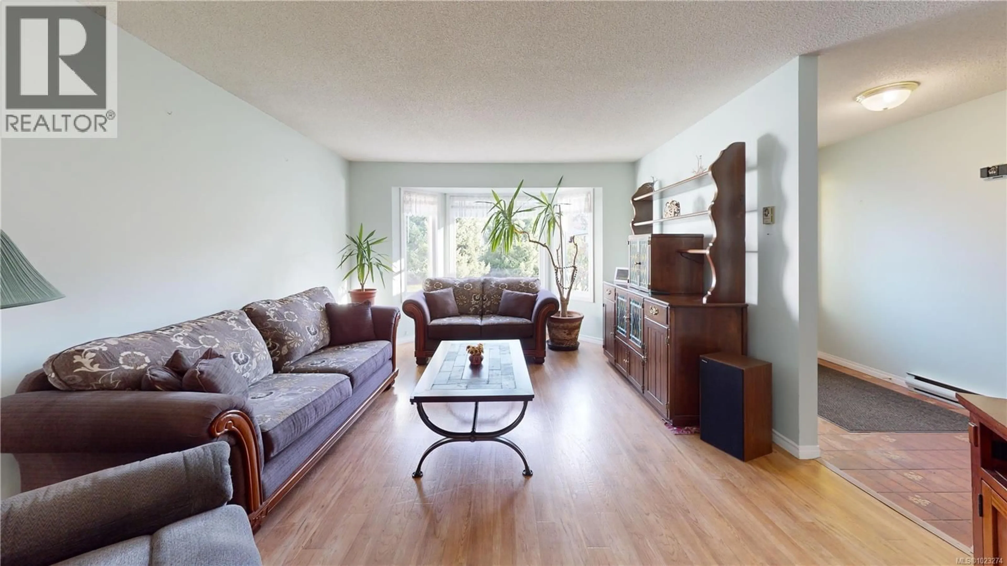 Living room with furniture, wood/laminate floor for 315 PEACOCK STREET, Parksville British Columbia V9P1M5