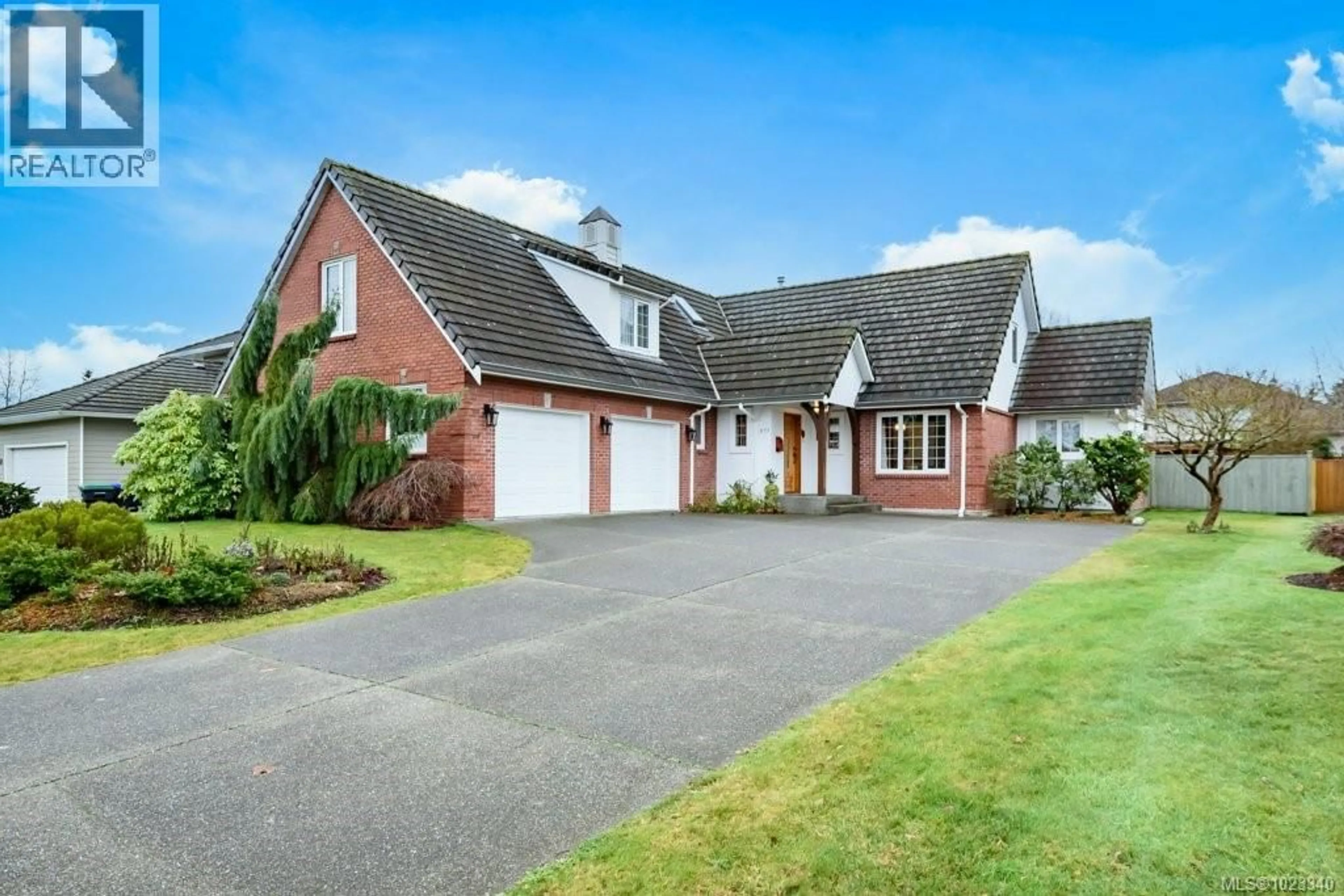 Home with brick exterior material, street for 971 CROWN ISLE DRIVE, Courtenay British Columbia V9N8R6