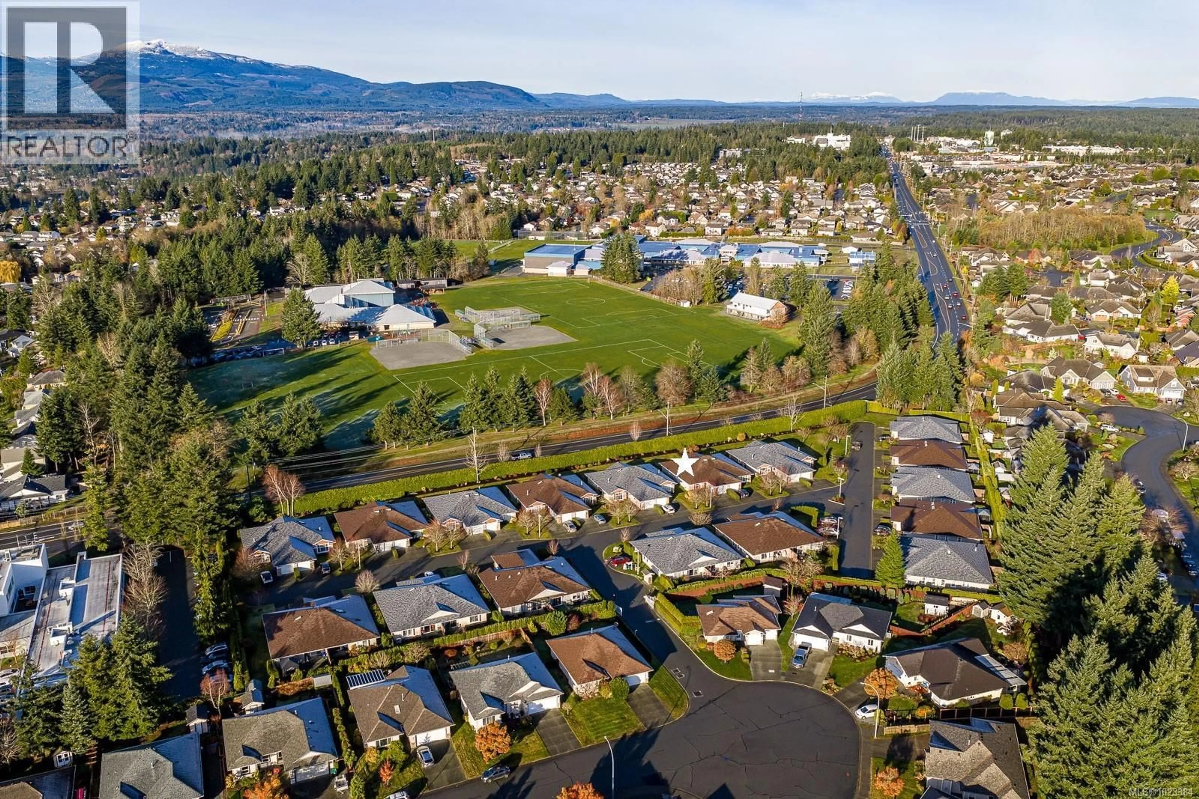 A pic from outside/outdoor area/front of a property/back of a property/a pic from drone, mountain view for 117 - 1919 ST. ANDREWS PLACE, Courtenay British Columbia V9N9J4