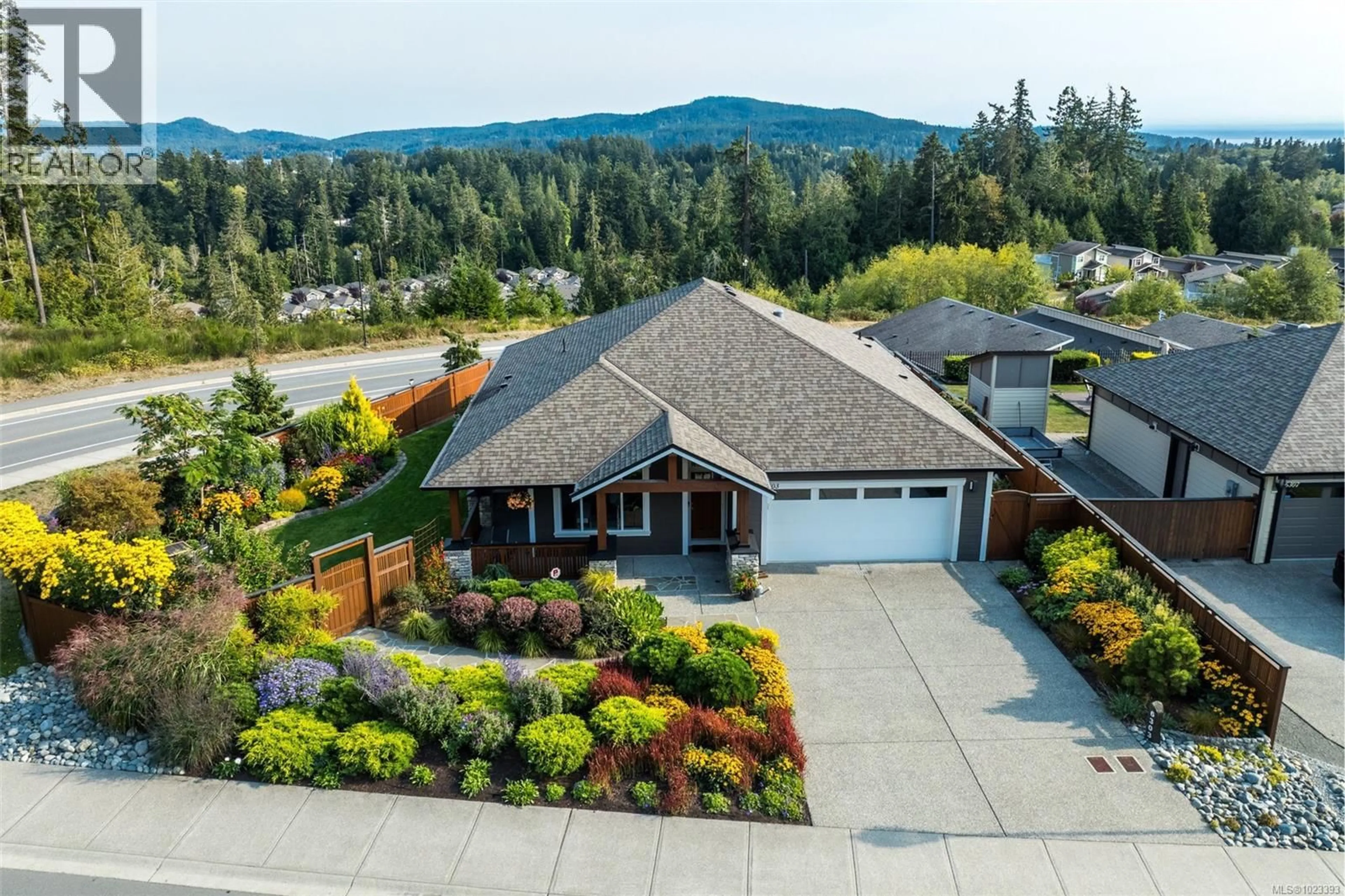 A pic from outside/outdoor area/front of a property/back of a property/a pic from drone, mountain view for 6303 RIVERSTONE DRIVE, Sooke British Columbia V9Z1N4