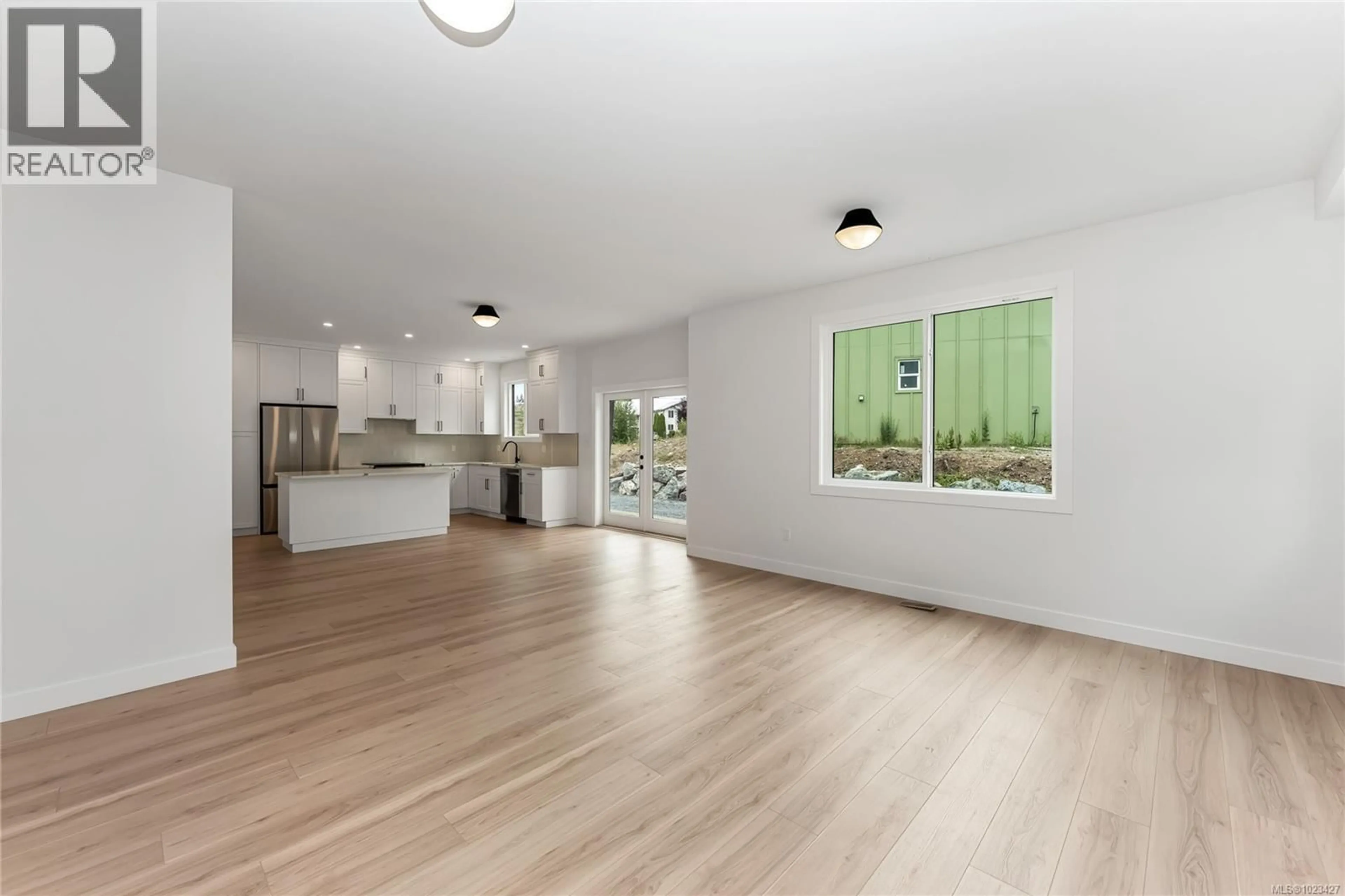 Open concept kitchen, wood/laminate floor for 219 COWICHAN LAKE ROAD, Lake Cowichan British Columbia V0R2G0