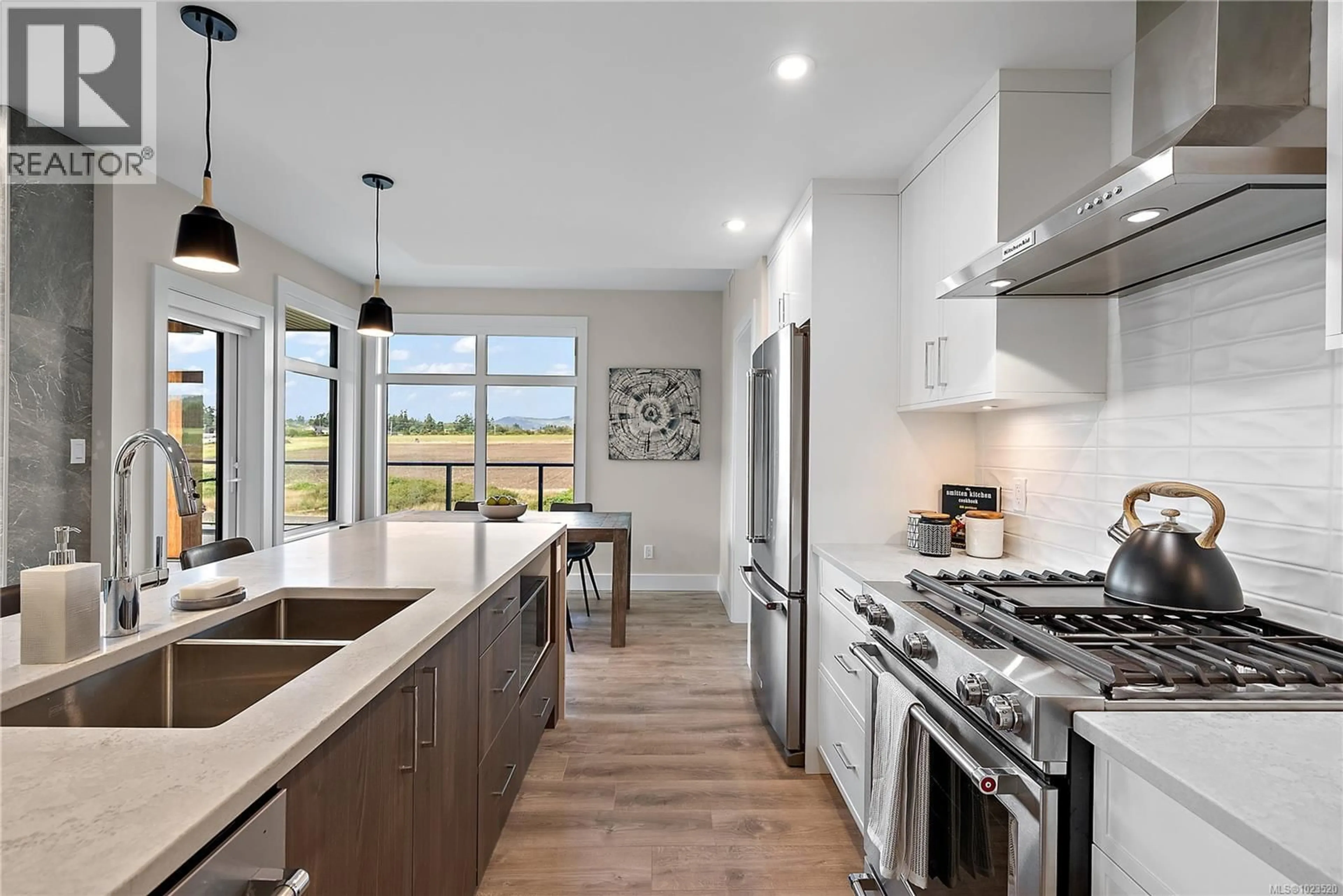 Open concept kitchen, ceramic/tile floor for 309 - 2520 HACKETT CRESCENT, Central Saanich British Columbia V8M0C5