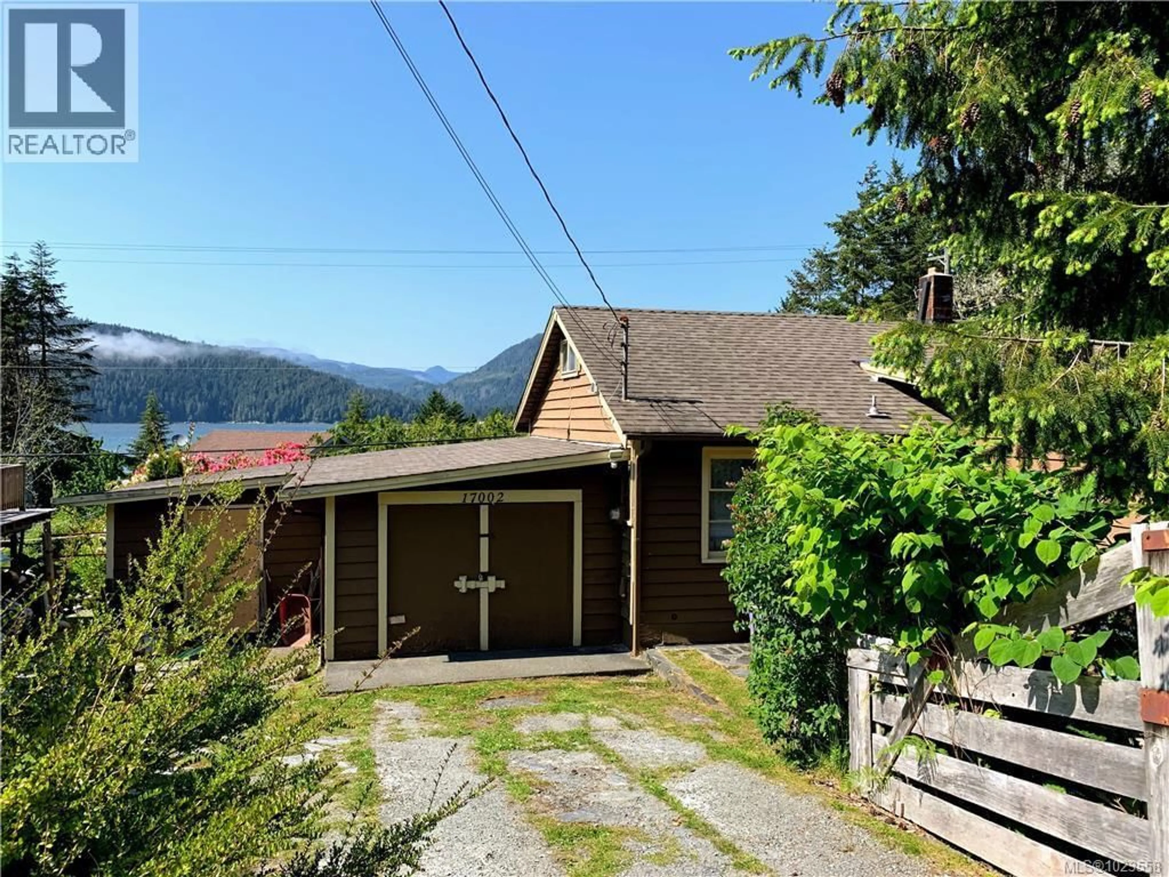 A pic from outside/outdoor area/front of a property/back of a property/a pic from drone, mountain view for 17002 WICKANNINISH ROAD, Port Renfrew British Columbia V0S1K0