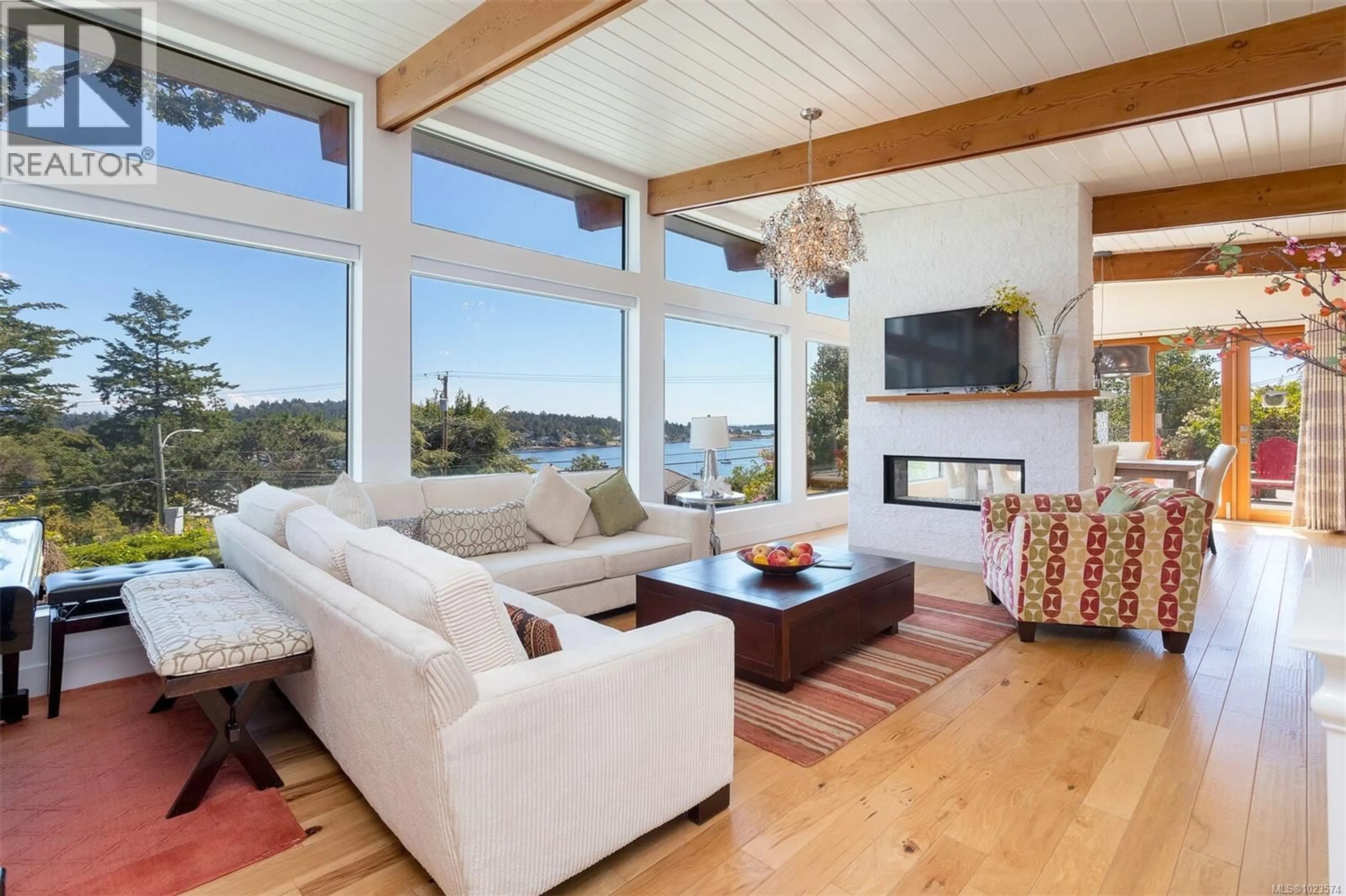 Living room with furniture, wood/laminate floor for 2597 VISTA BAY ROAD, Saanich British Columbia V8P3G1