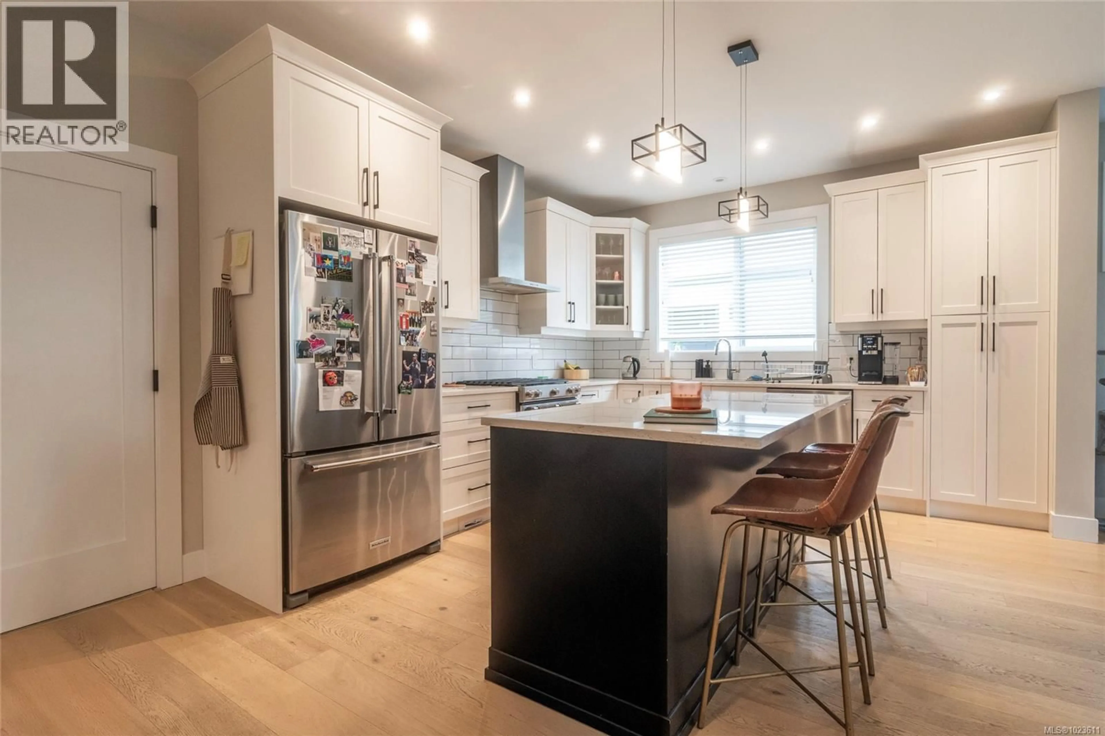 Open concept kitchen, wood/laminate floor for 4247 PULLET PLACE, Saanich British Columbia V8X5J2