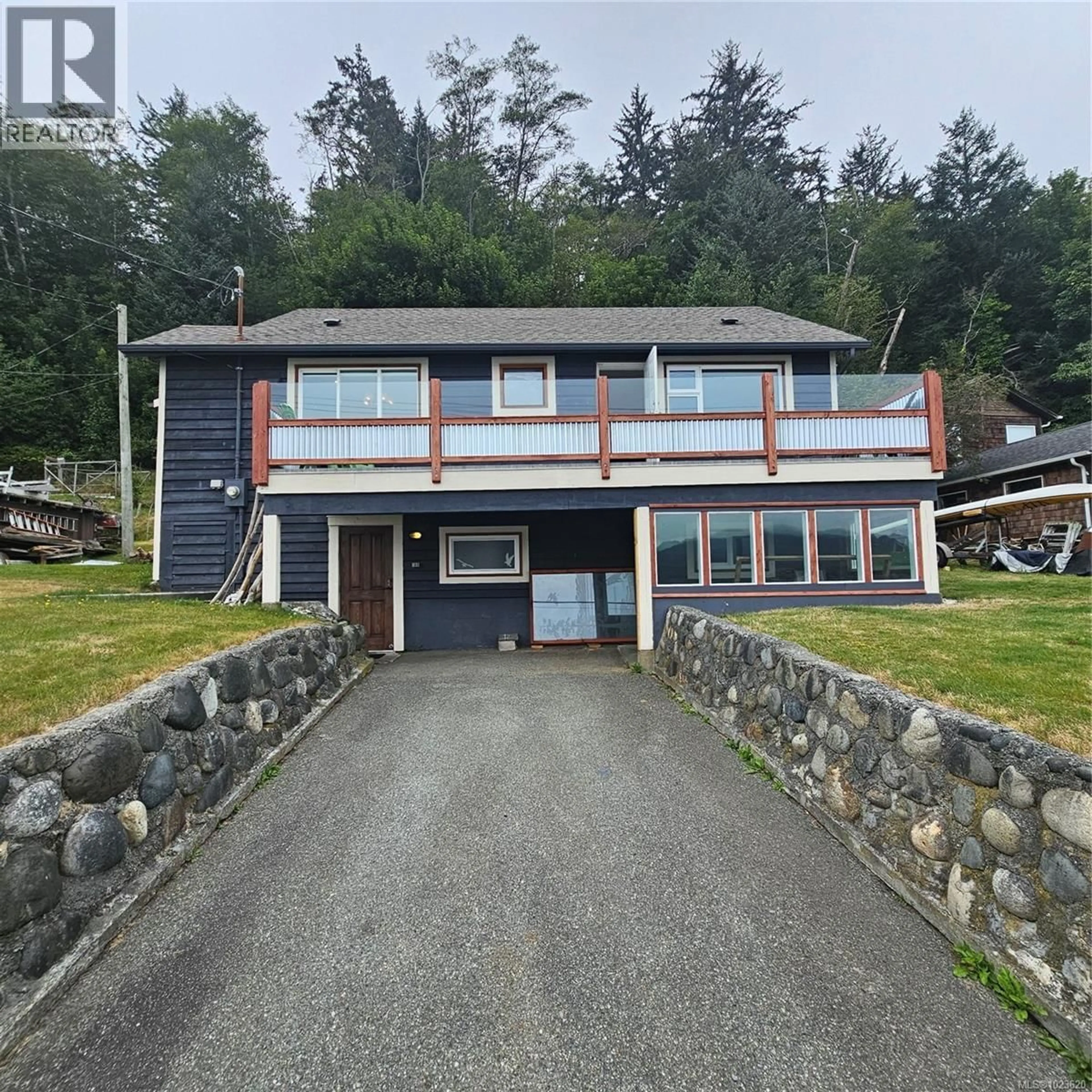 A pic from outside/outdoor area/front of a property/back of a property/a pic from drone, water/lake/river/ocean view for 497 FIR STREET, Alert Bay British Columbia V0N1A0