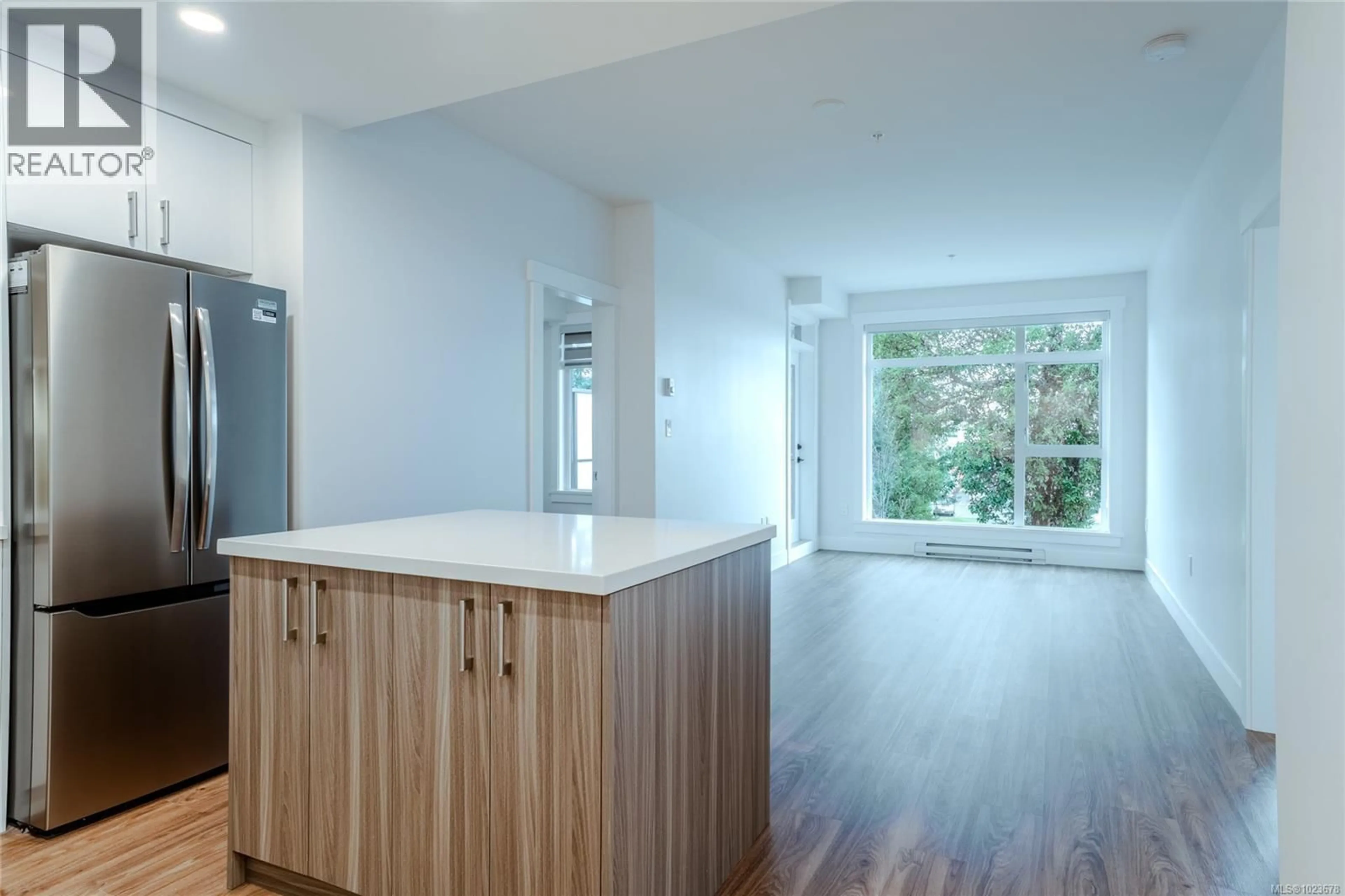 Open concept kitchen, wood/laminate floor for 207 - 6320 SENTINAL DRIVE, Nanaimo British Columbia V9V1W4