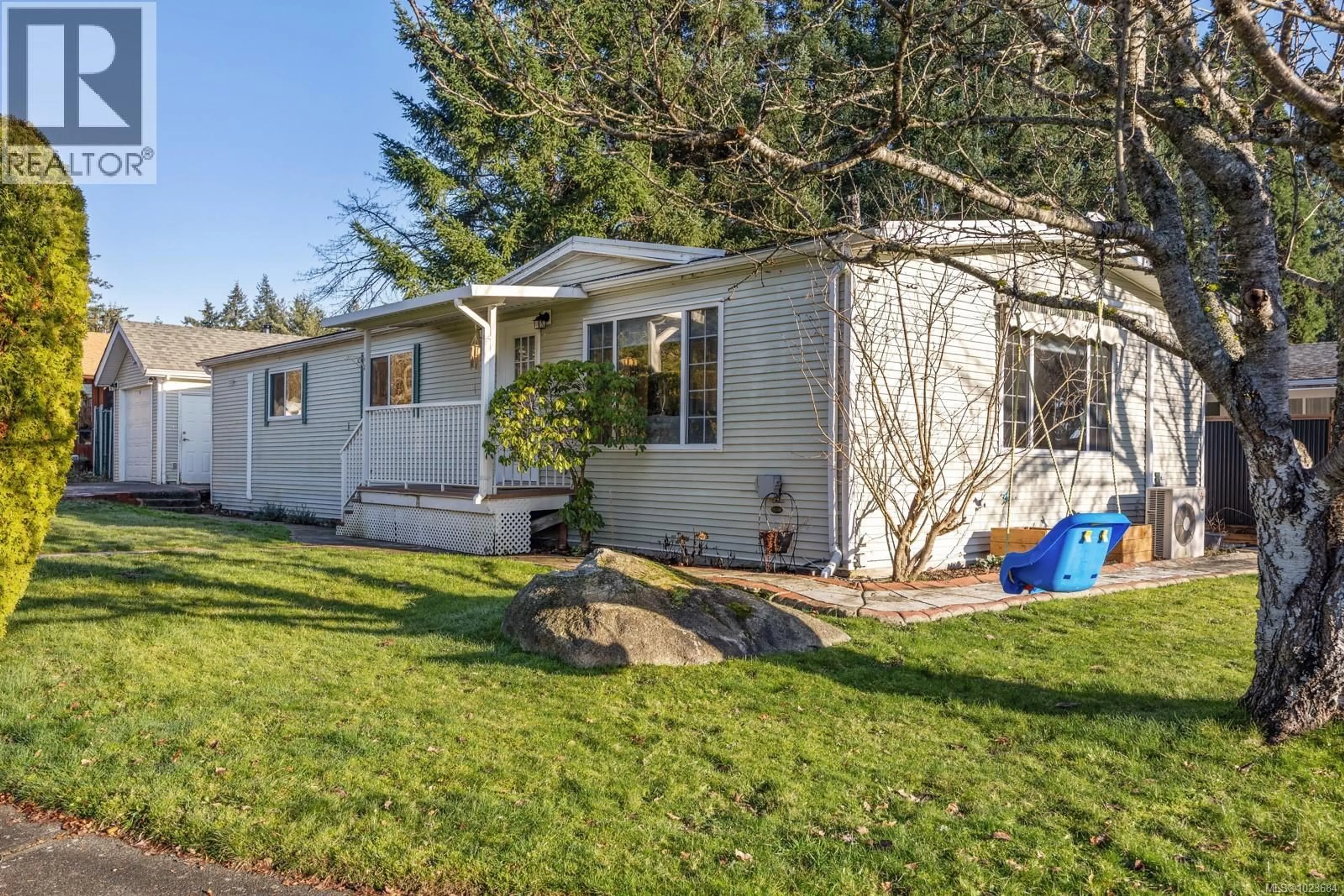 Home with vinyl exterior material, street for 2153 STADACONA DRIVE, Comox British Columbia V9M3P9