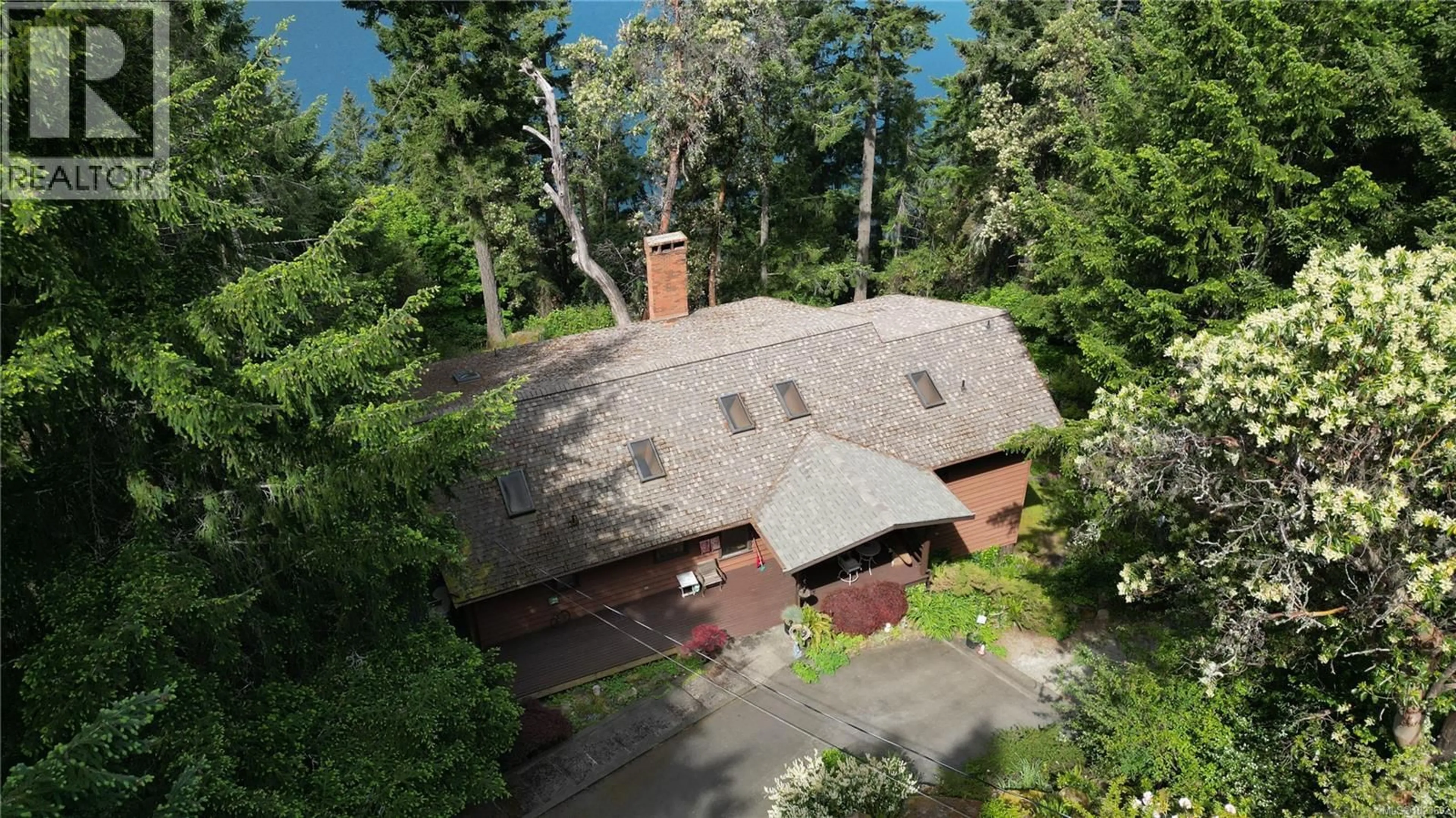 A pic from outside/outdoor area/front of a property/back of a property/a pic from drone, forest/trees view for 250 SOUTH BANK DRIVE, Salt Spring British Columbia V8K1M7