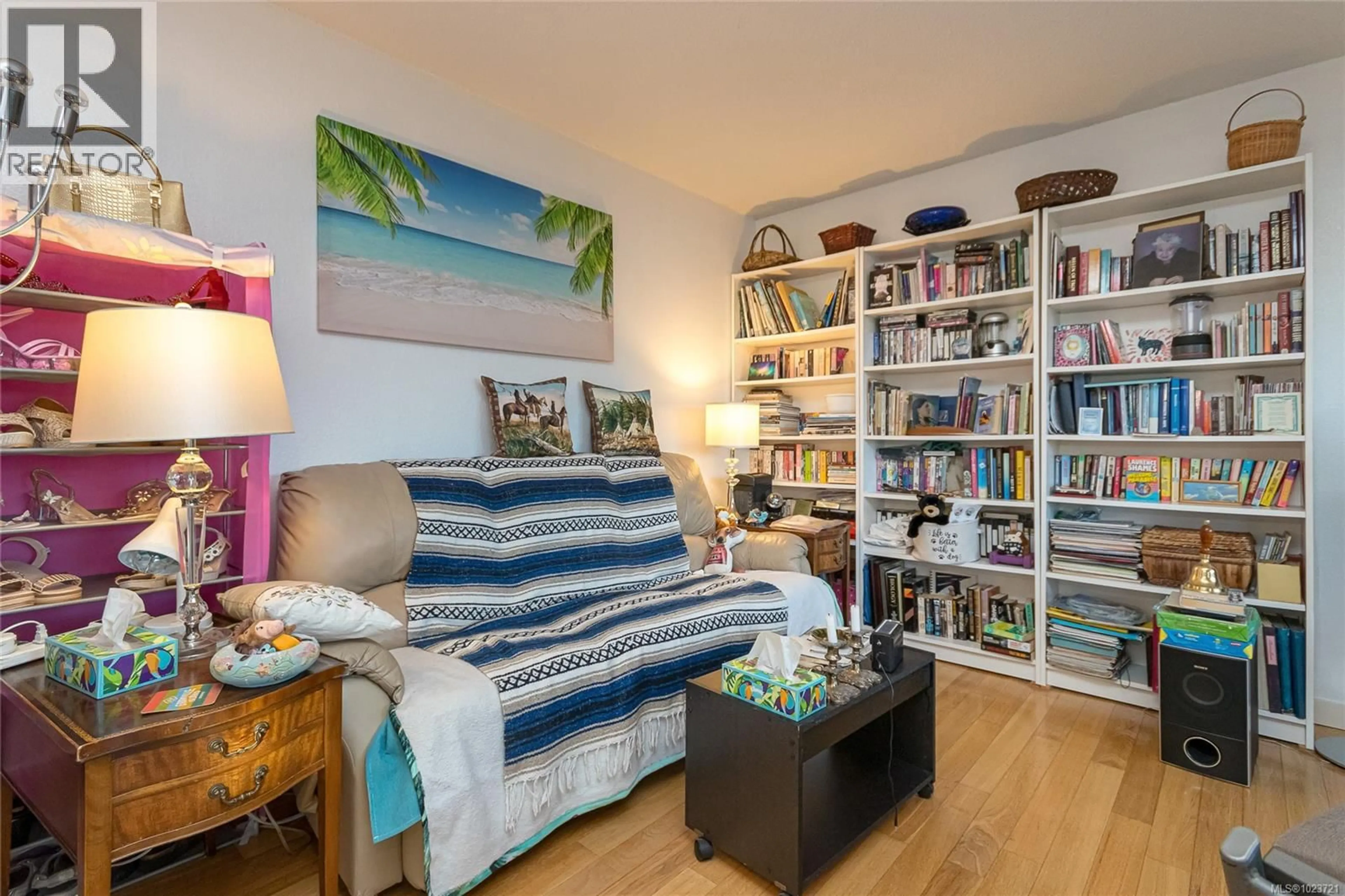 Living room with furniture, wood/laminate floor for 405 - 3800 QUADRA STREET, Saanich British Columbia V8X1H8