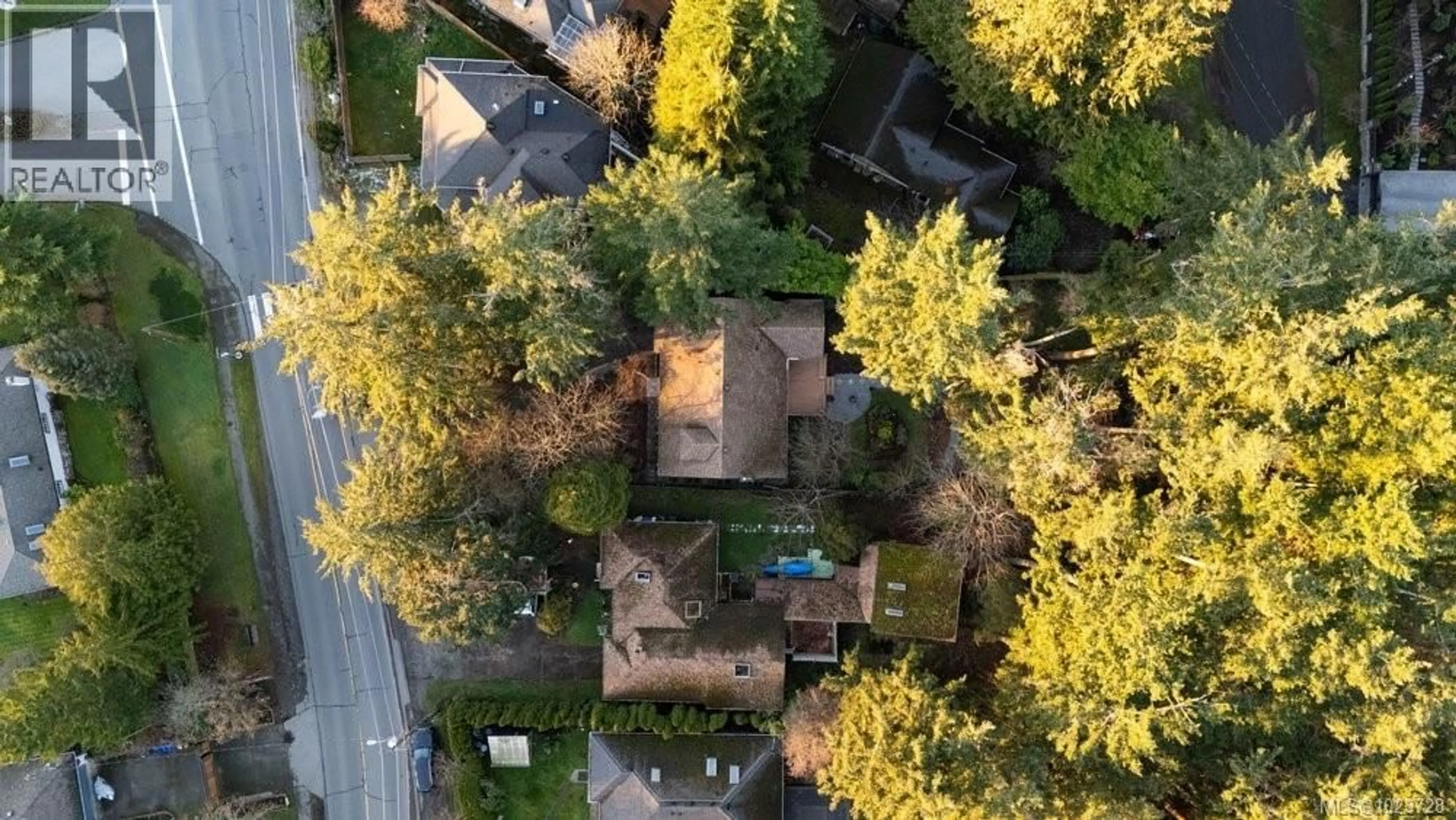 A pic from outside/outdoor area/front of a property/back of a property/a pic from drone, forest/trees view for 4815 CORDOVA BAY ROAD, Saanich British Columbia V8Y2J8