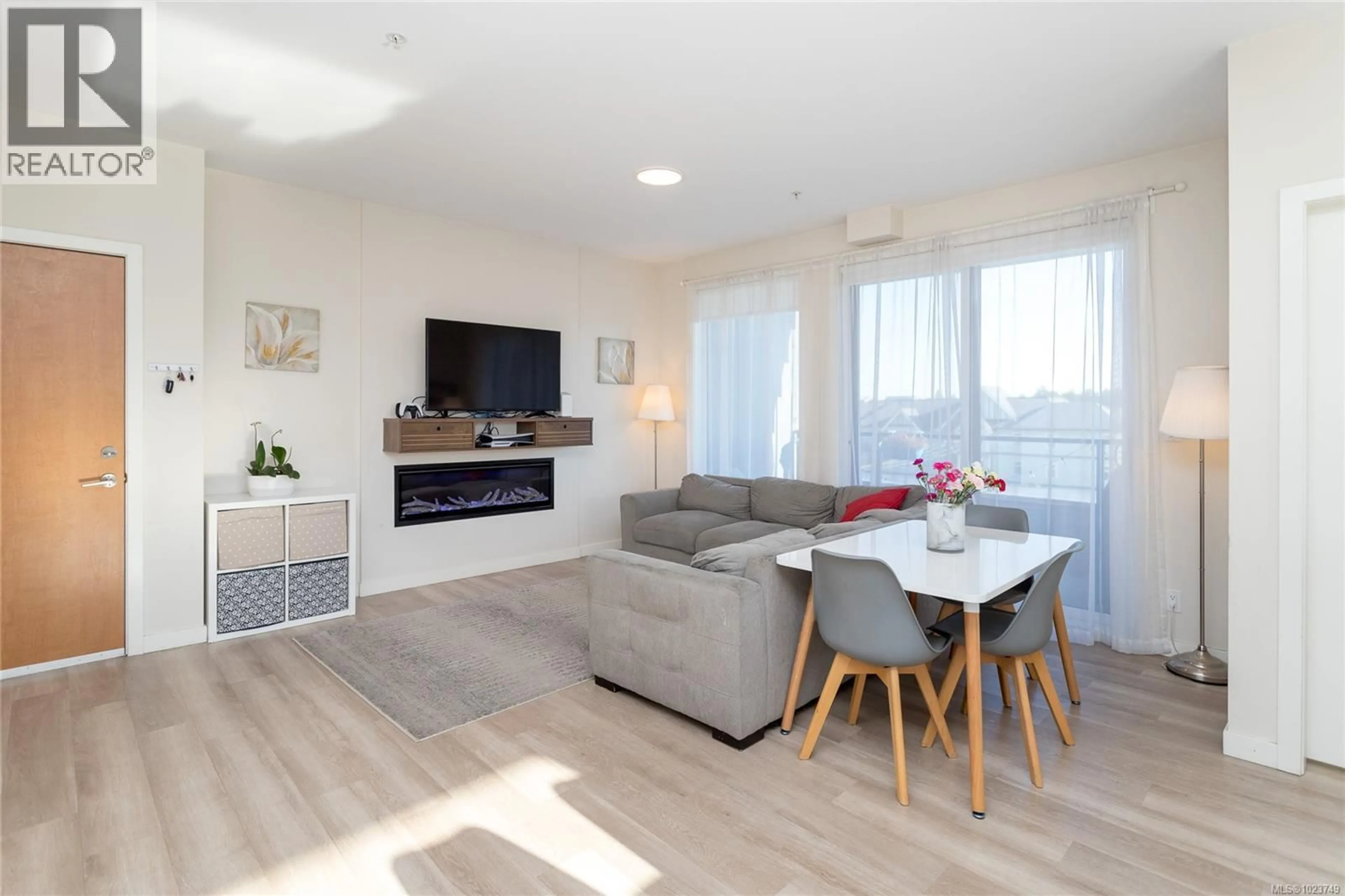 Living room with furniture, wood/laminate floor for 506 - 815 ORONO AVENUE, Langford British Columbia V9B2T9