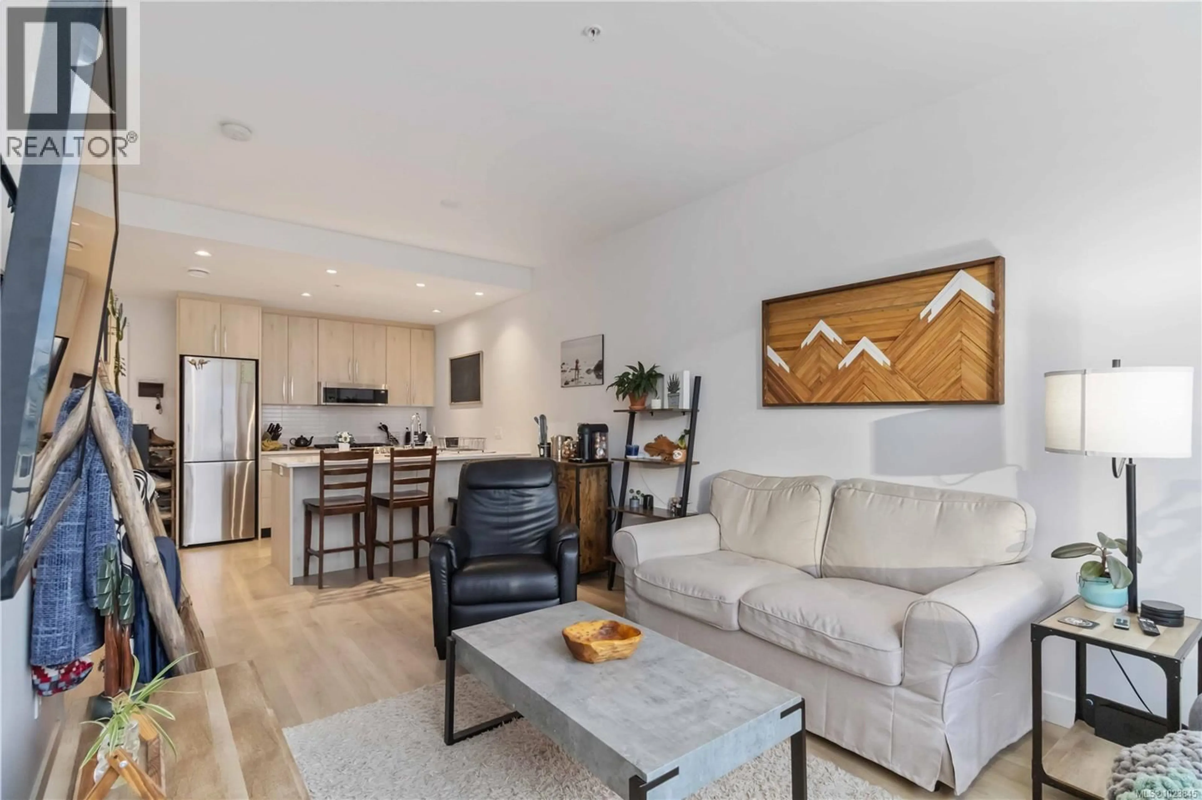 Living room with furniture, wood/laminate floor for 302 - 9864 FOURTH STREET, Sidney British Columbia V8L2Z4