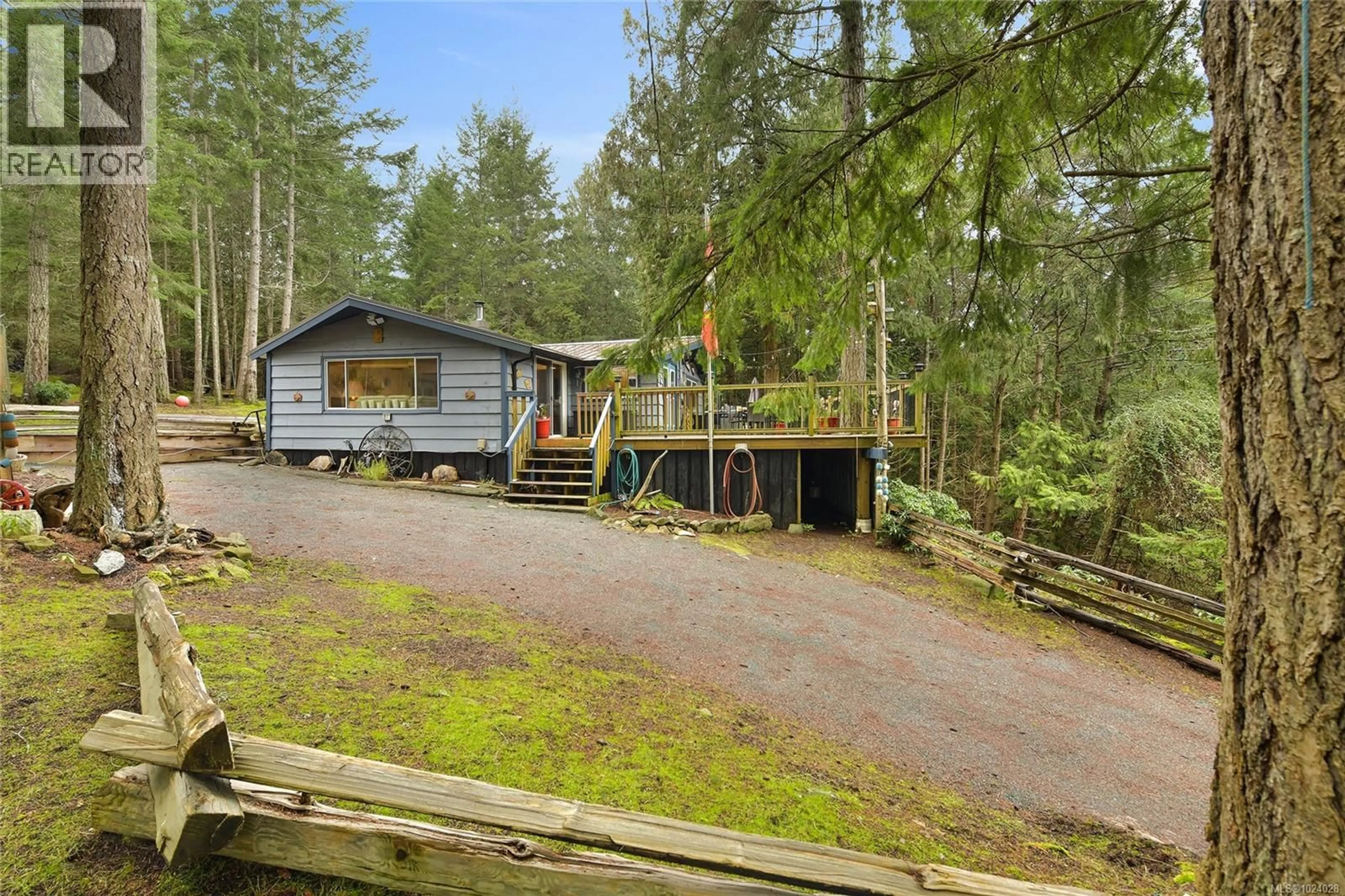 A pic from outside/outdoor area/front of a property/back of a property/a pic from drone, forest/trees view for 493 ABBOTT ROAD, Mayne Island British Columbia V0N2J1