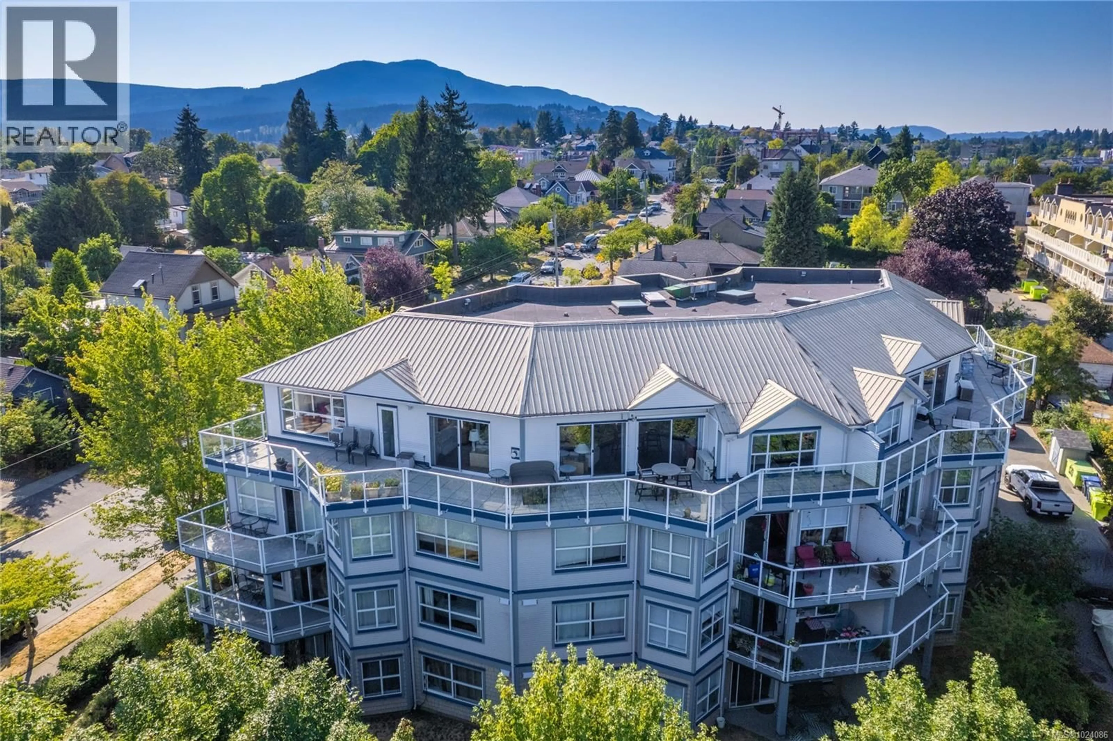 A pic from outside/outdoor area/front of a property/back of a property/a pic from drone, mountain view for 401 - 650 PRIDEAUX STREET, Nanaimo British Columbia V9R2P1