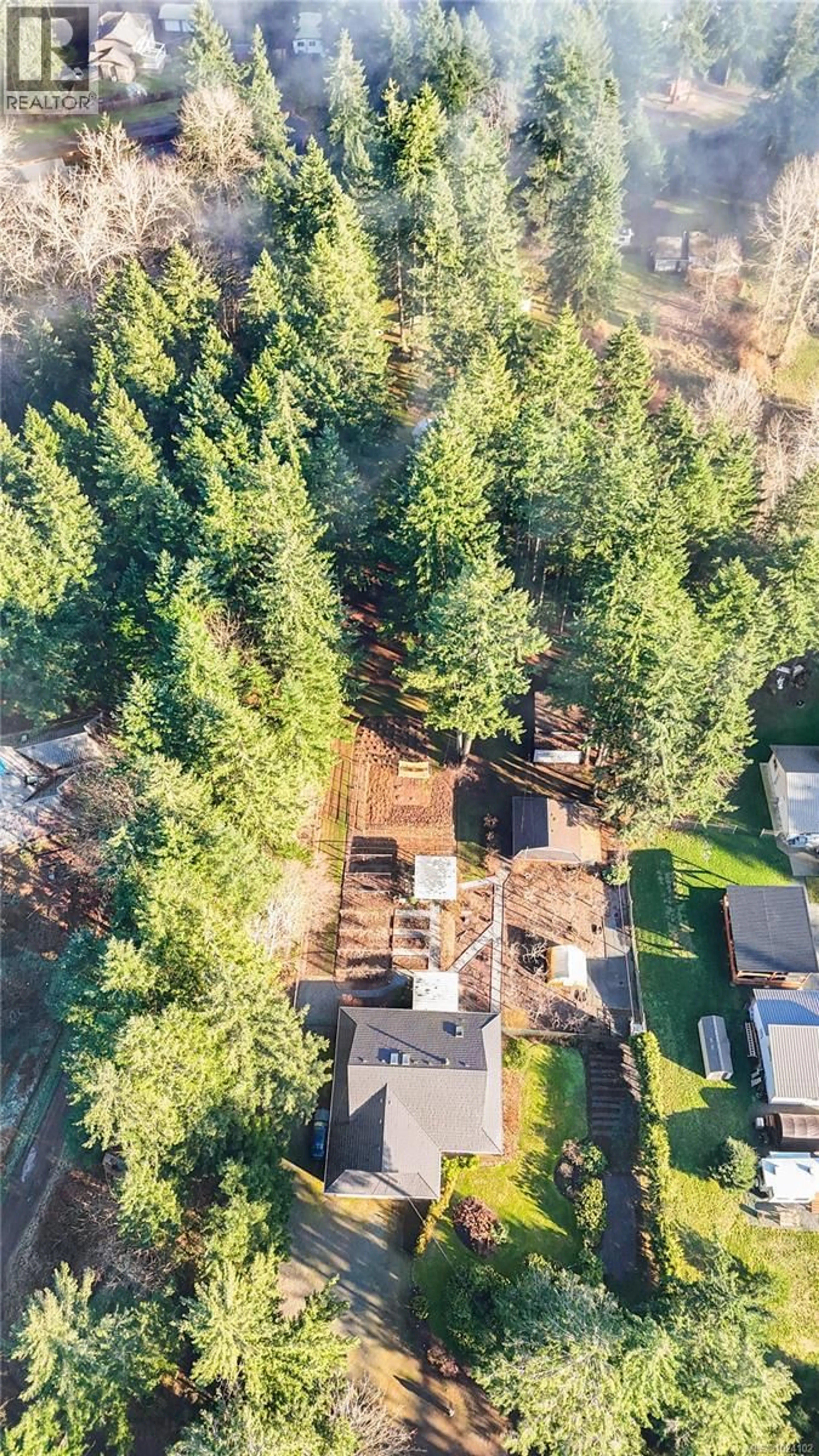 A pic from outside/outdoor area/front of a property/back of a property/a pic from drone, forest/trees view for 4496 GARY LANE, Campbell River British Columbia V9H1B8