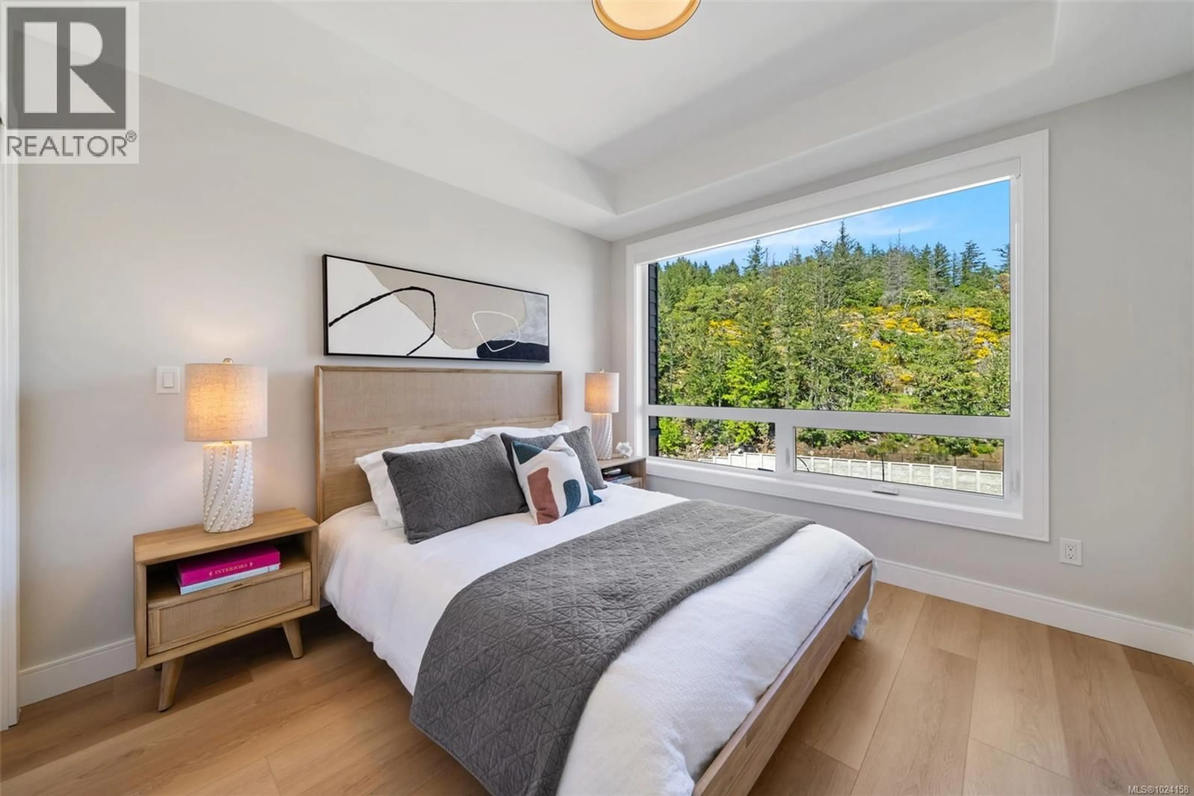 Bedroom with bed, wood/laminate floor for 508 - 1810 SELENITE PLACE, Langford British Columbia V9B7E2