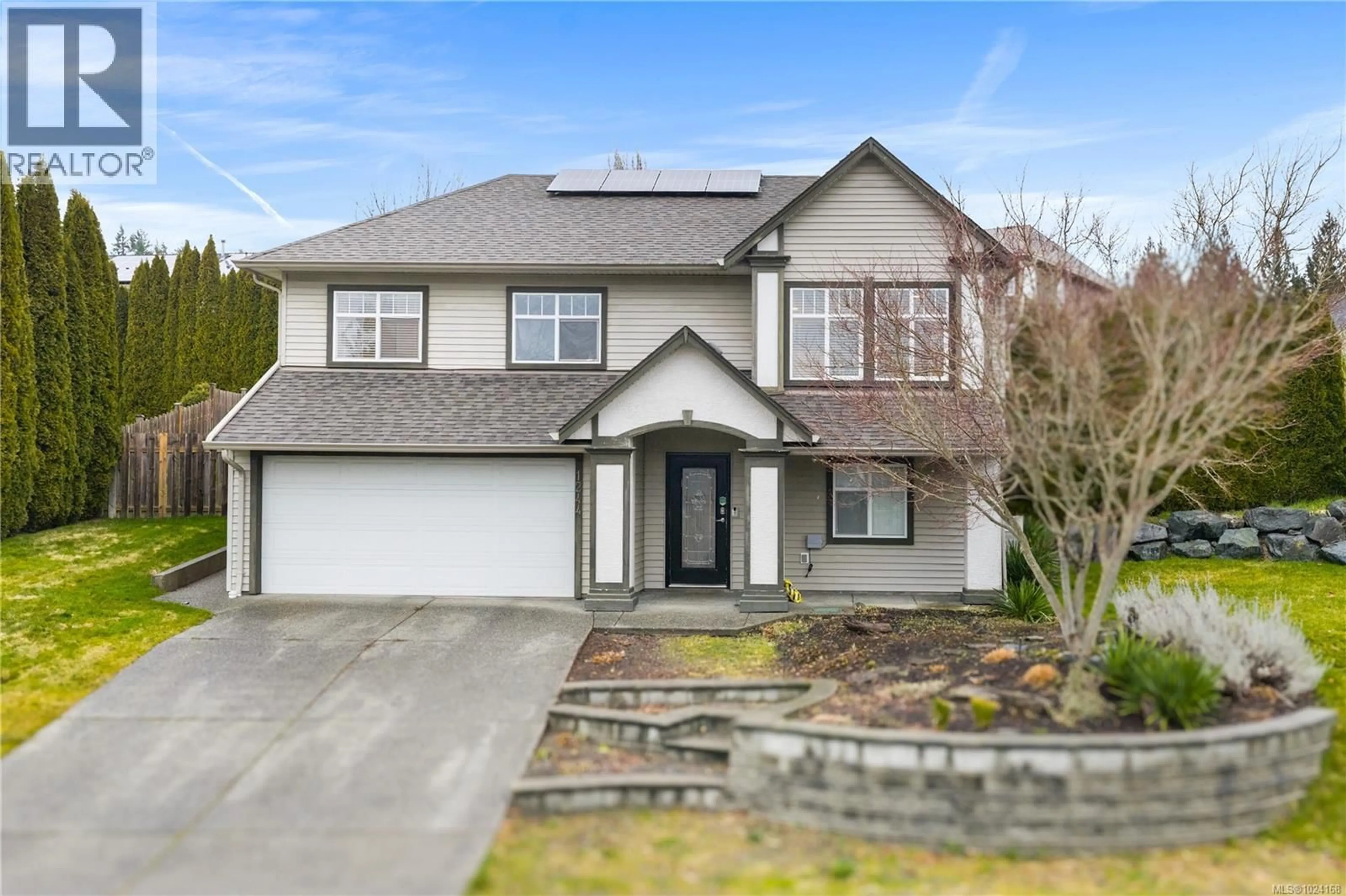 Home with vinyl exterior material, street for 1244 BLESBOK ROAD, Campbell River British Columbia V9W7X6