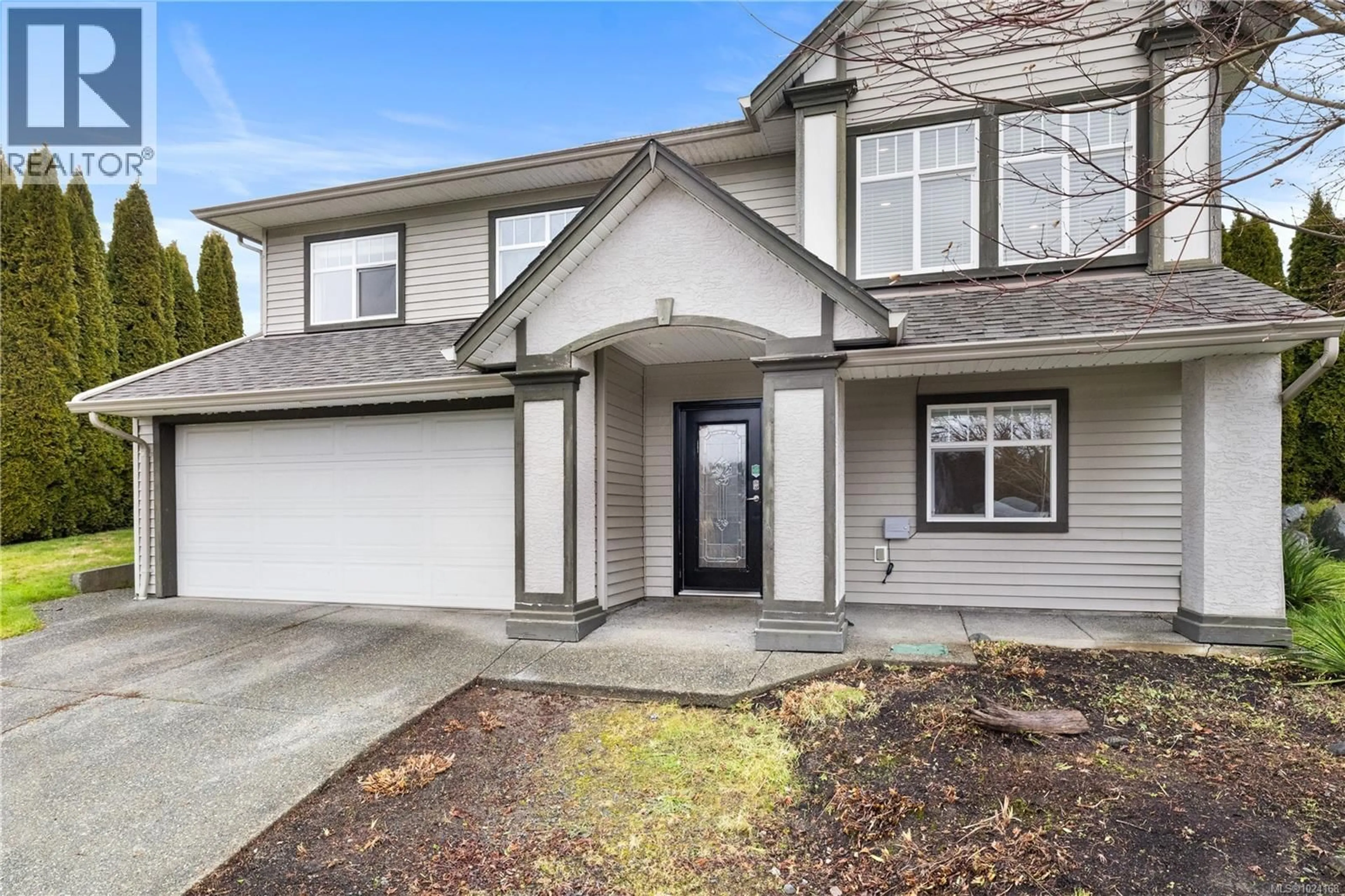 Home with vinyl exterior material, street for 1244 BLESBOK ROAD, Campbell River British Columbia V9W7X6