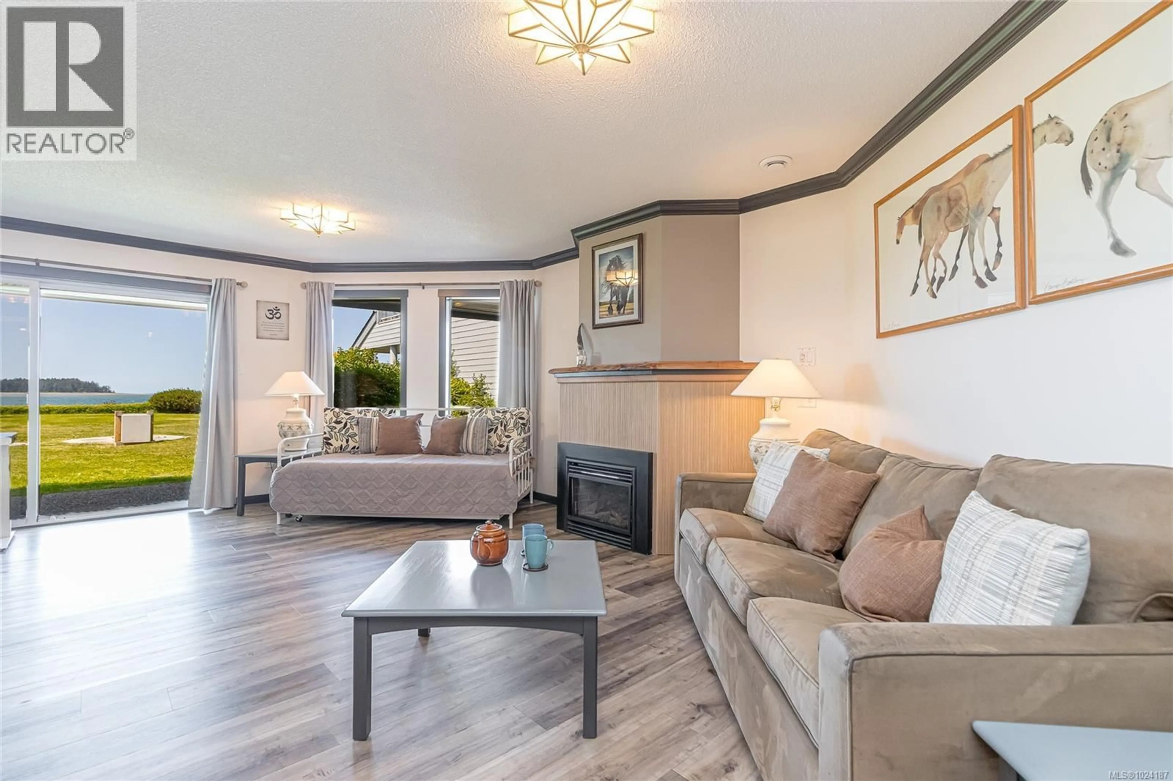 Living room with furniture, wood/laminate floor for 613 - 1600 STROULGER ROAD, Nanoose Bay British Columbia V9P9B7