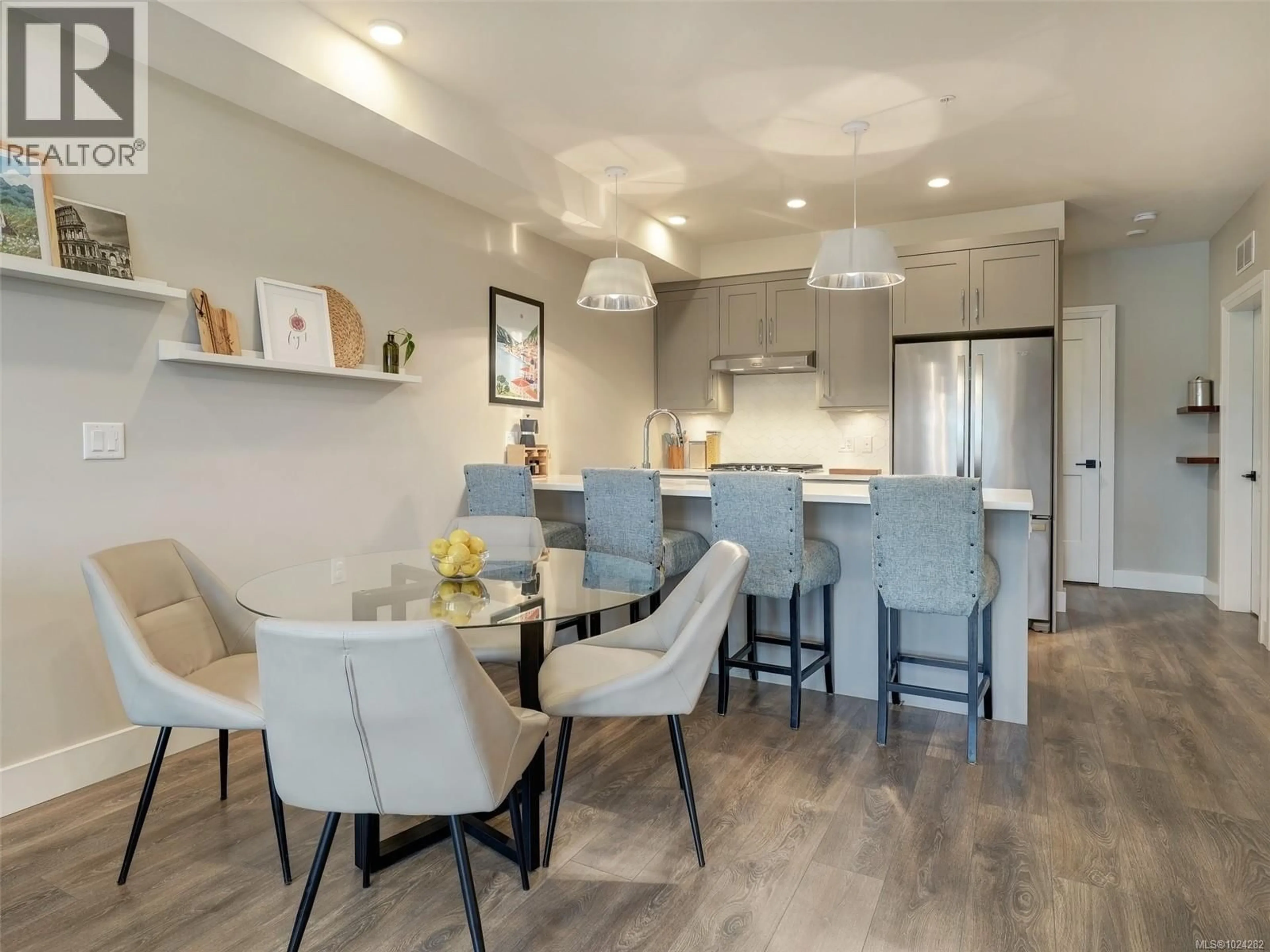 Open concept kitchen, wood/laminate floor for 503 - 741 TRAVINO LANE, Saanich British Columbia V8Z0E5