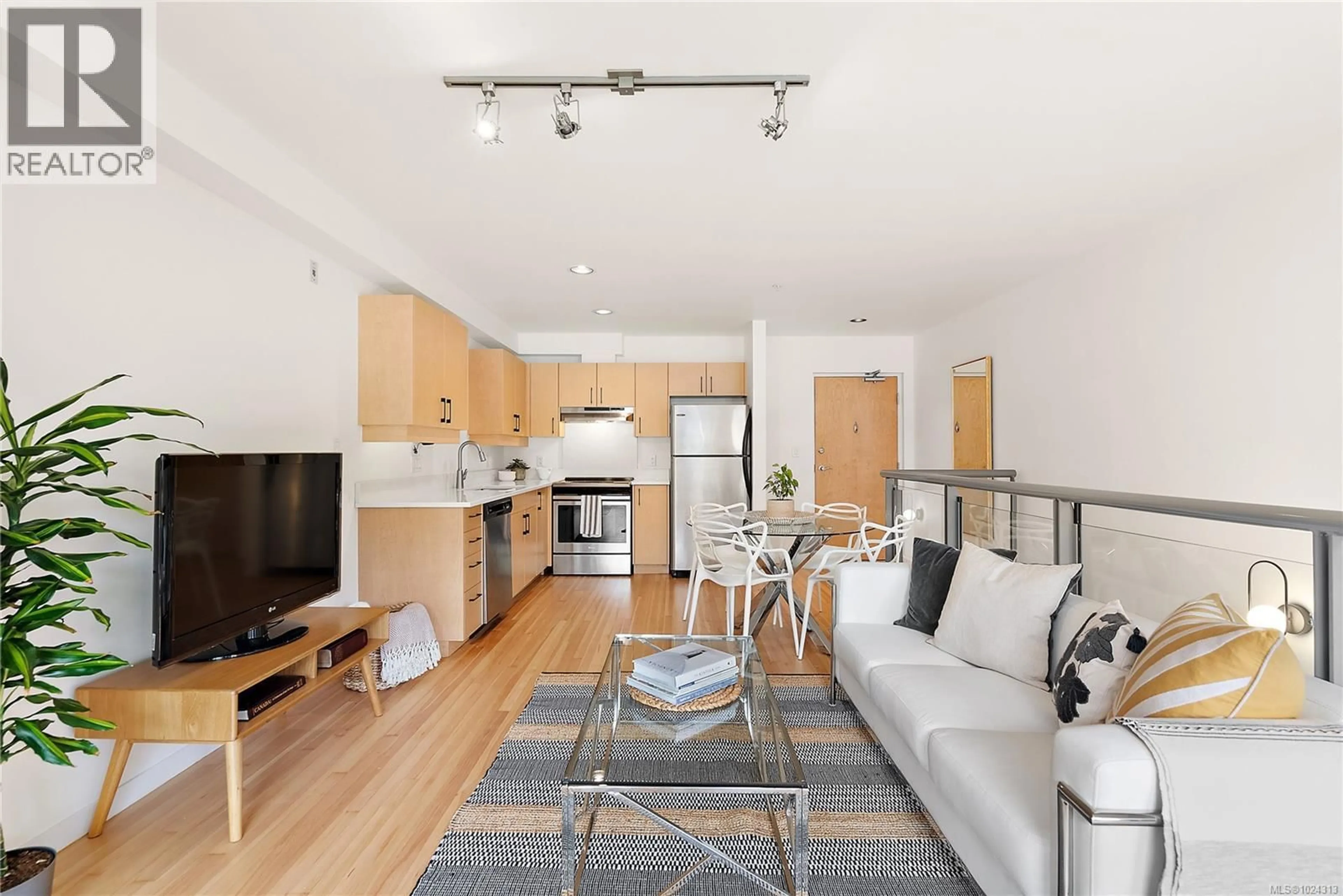 Living room with furniture, wood/laminate floor for 8 - 821 TYEE ROAD, Victoria British Columbia V9A7R2