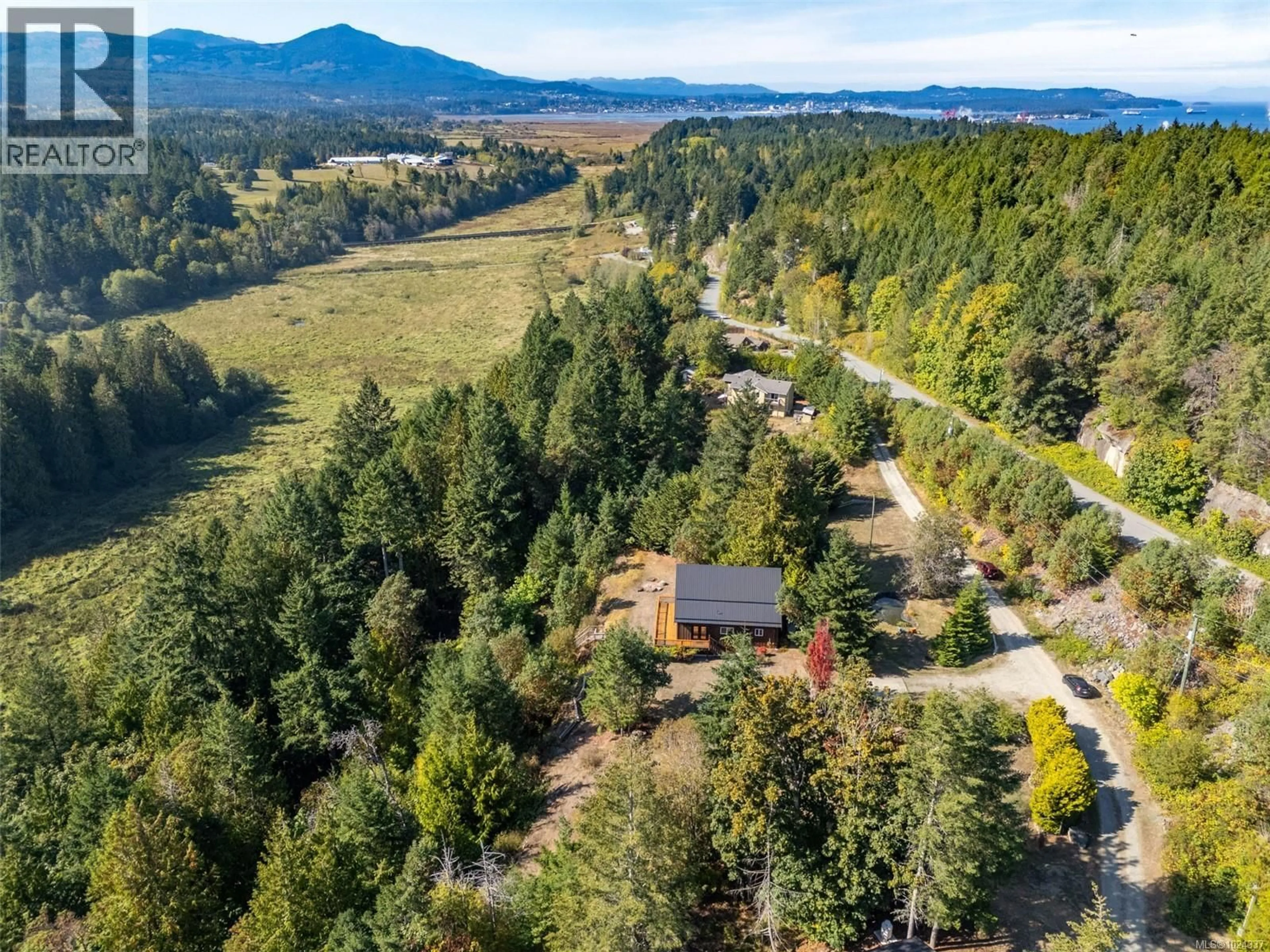 A pic from outside/outdoor area/front of a property/back of a property/a pic from drone, forest/trees view for 2405 LINDSEY ROAD, Nanaimo British Columbia V9X1X3