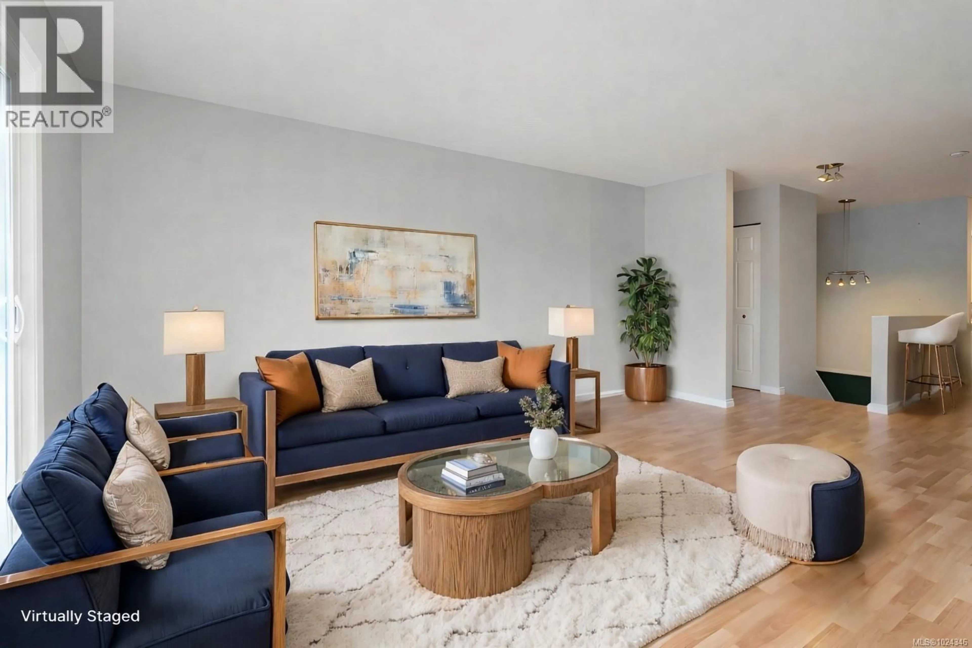 Living room with furniture, wood/laminate floor for 578 CARNATION PLACE, Saanich British Columbia V8Z6G5