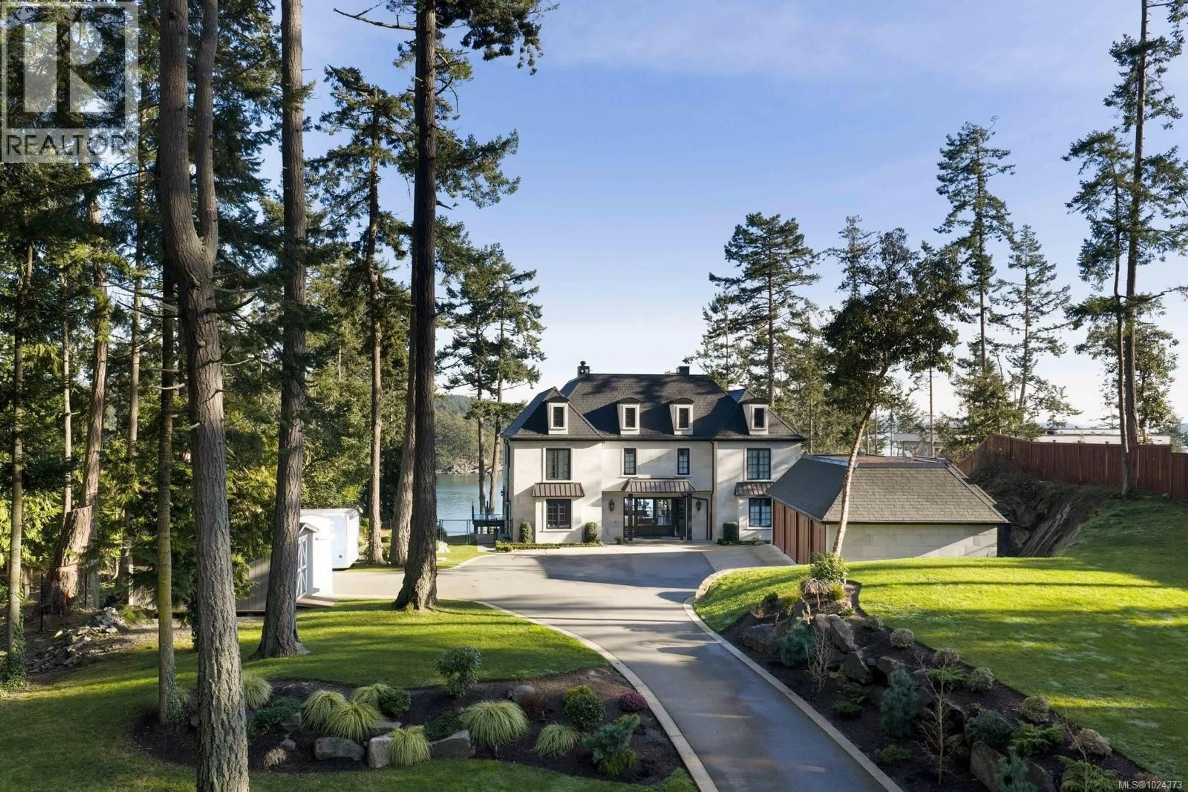 A pic from outside/outdoor area/front of a property/back of a property/a pic from drone, street for 10865 FERNIE WYND ROAD, North Saanich British Columbia V8L5H8