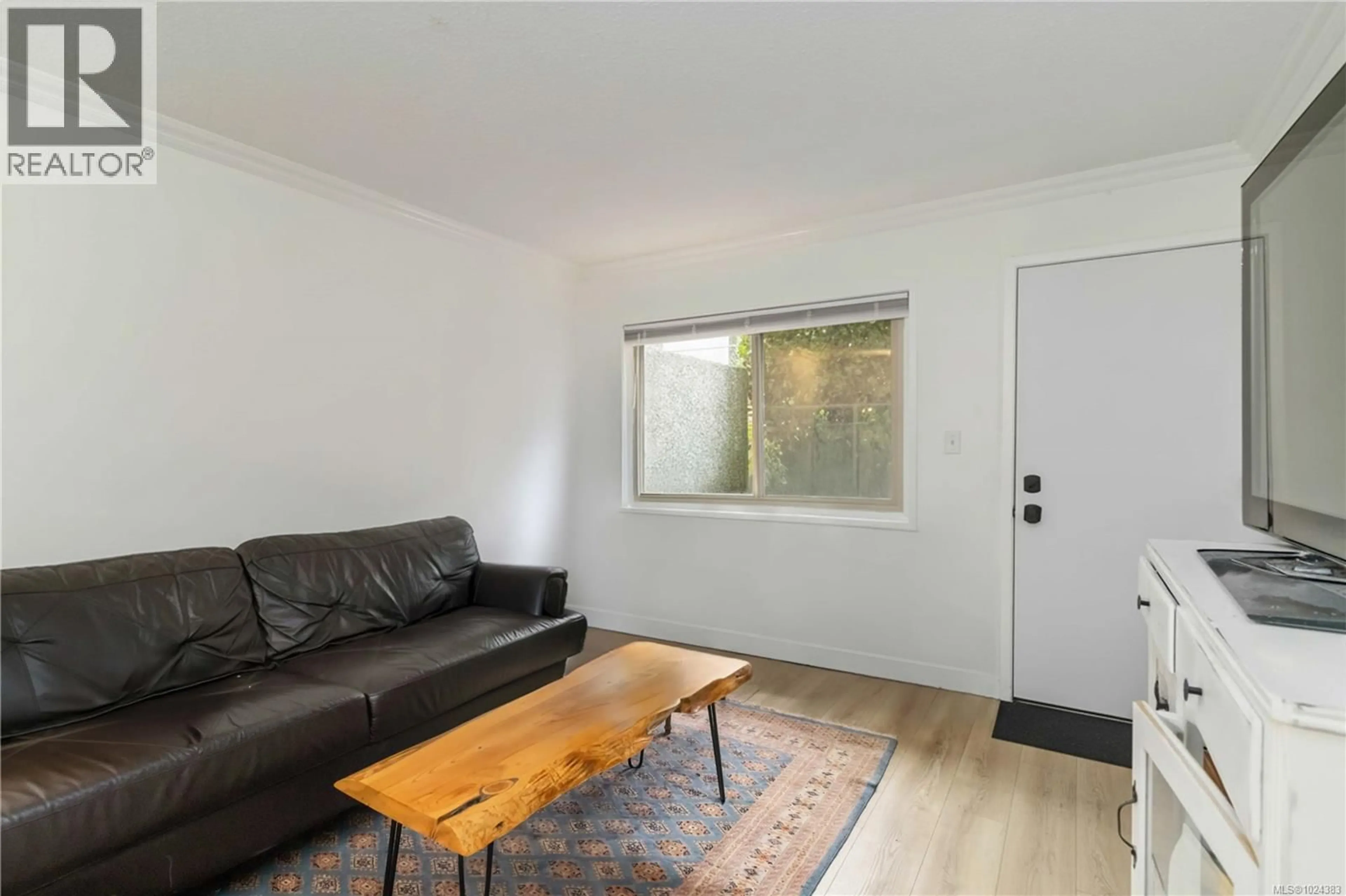 Living room with furniture, wood/laminate floor for 16 - 477 LAMPSON STREET, Esquimalt British Columbia V9A5Z4