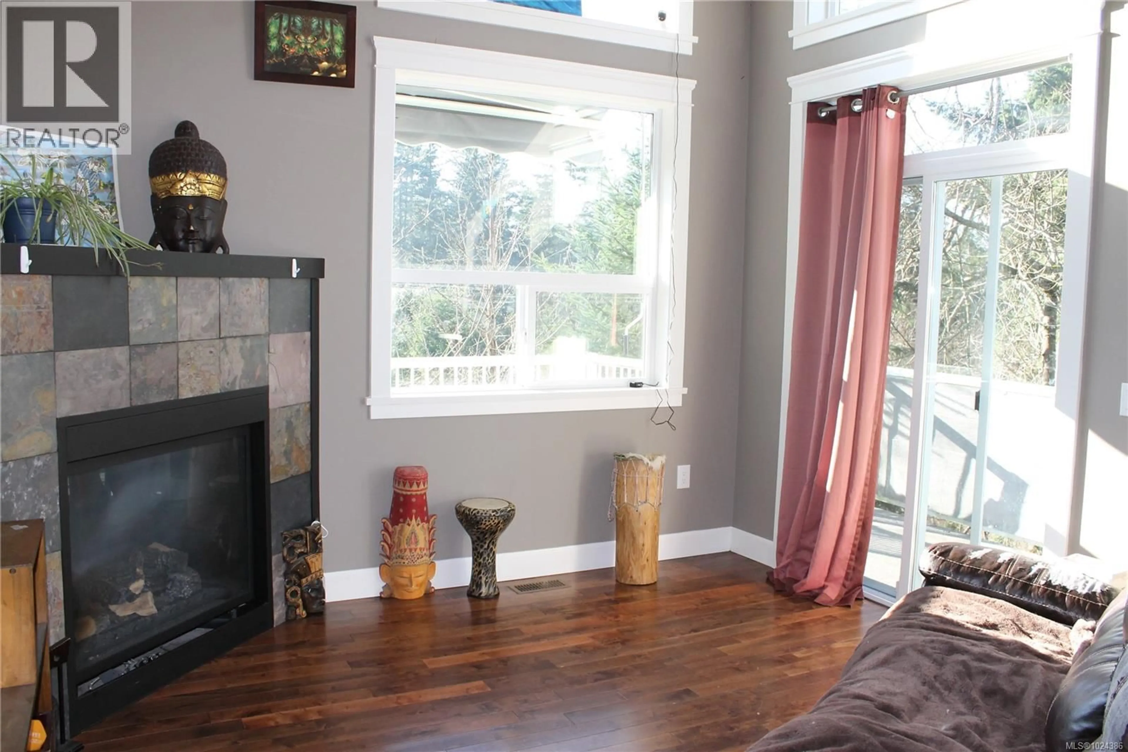 Living room with furniture, wood/laminate floor for 1540 NIMPKISH PLACE, Duncan British Columbia V9L0A6