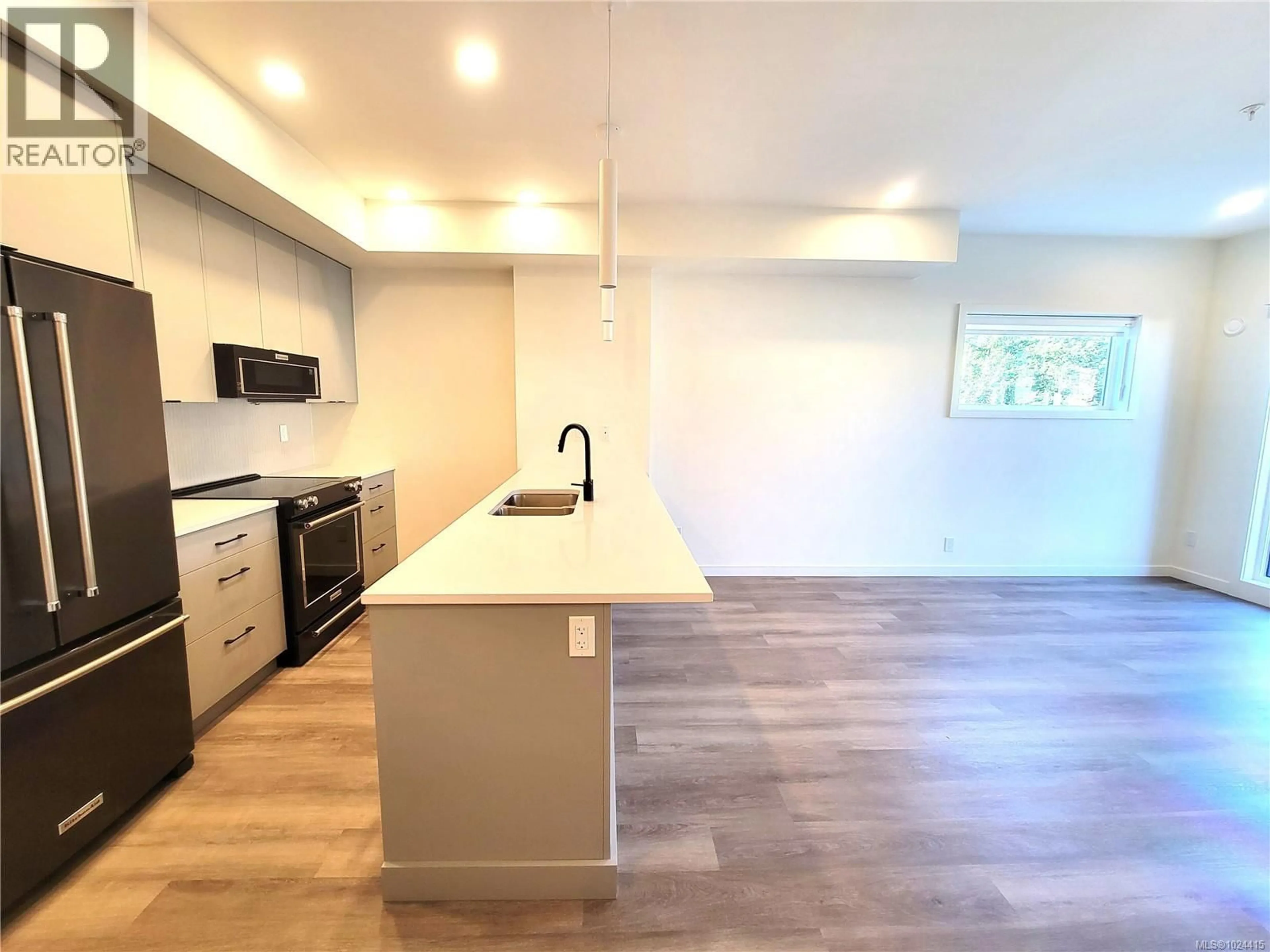 Open concept kitchen, wood/laminate floor for B503 - 1102 ESQUIMALT ROAD, Esquimalt British Columbia V9A6A1