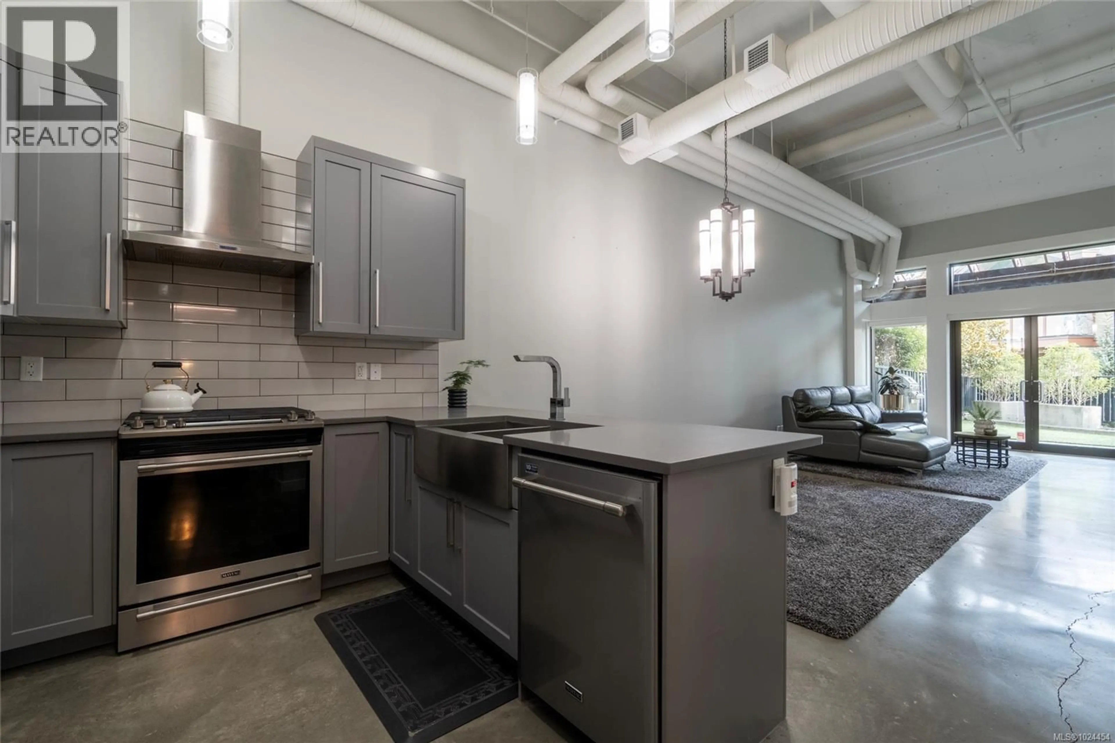 Open concept kitchen, cement floor for 108 - 2049 COUNTRY CLUB WAY, Langford British Columbia V9B0H8