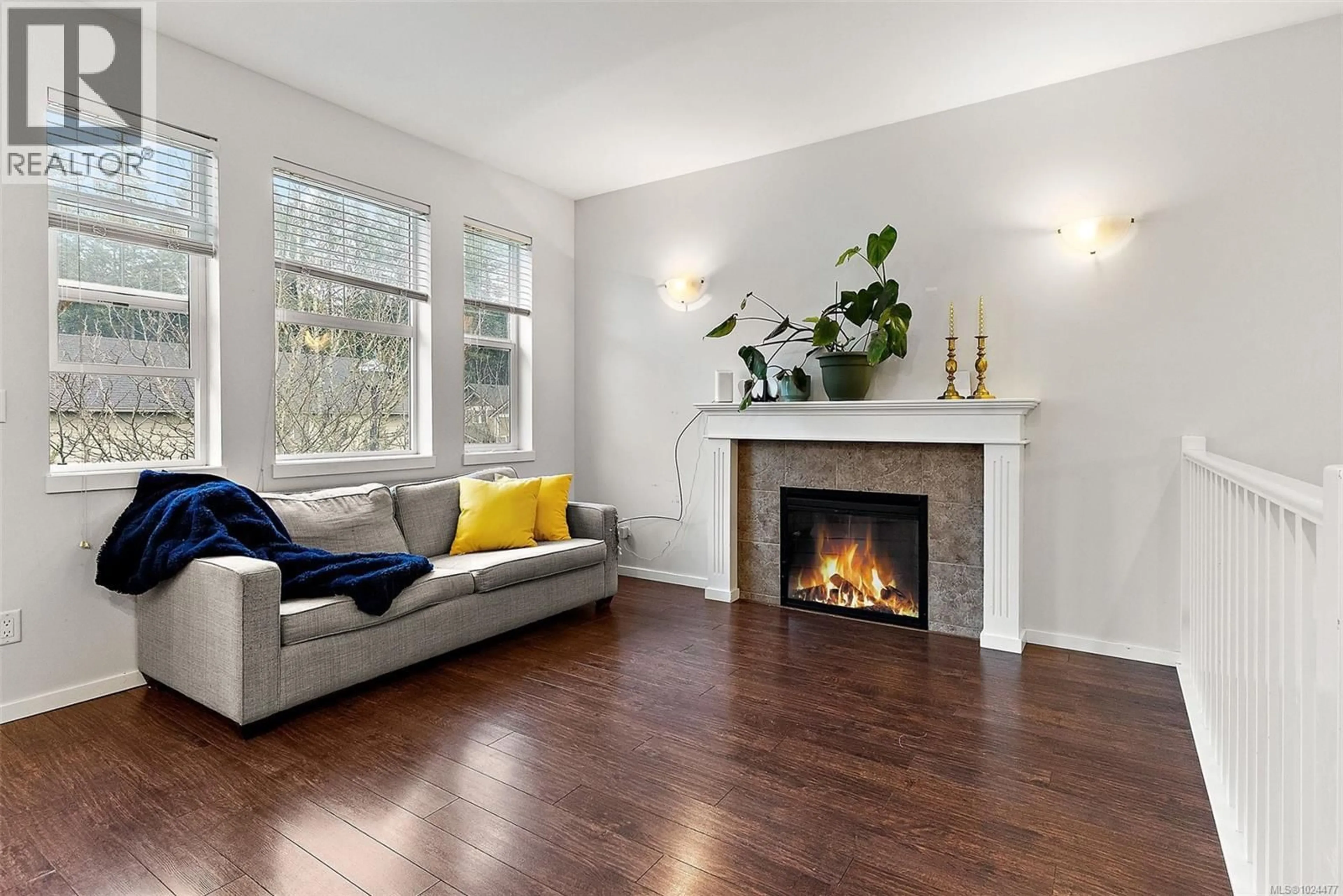 Living room with furniture, wood/laminate floor for 1051 FASHODA PLACE, Langford British Columbia V9C3X1