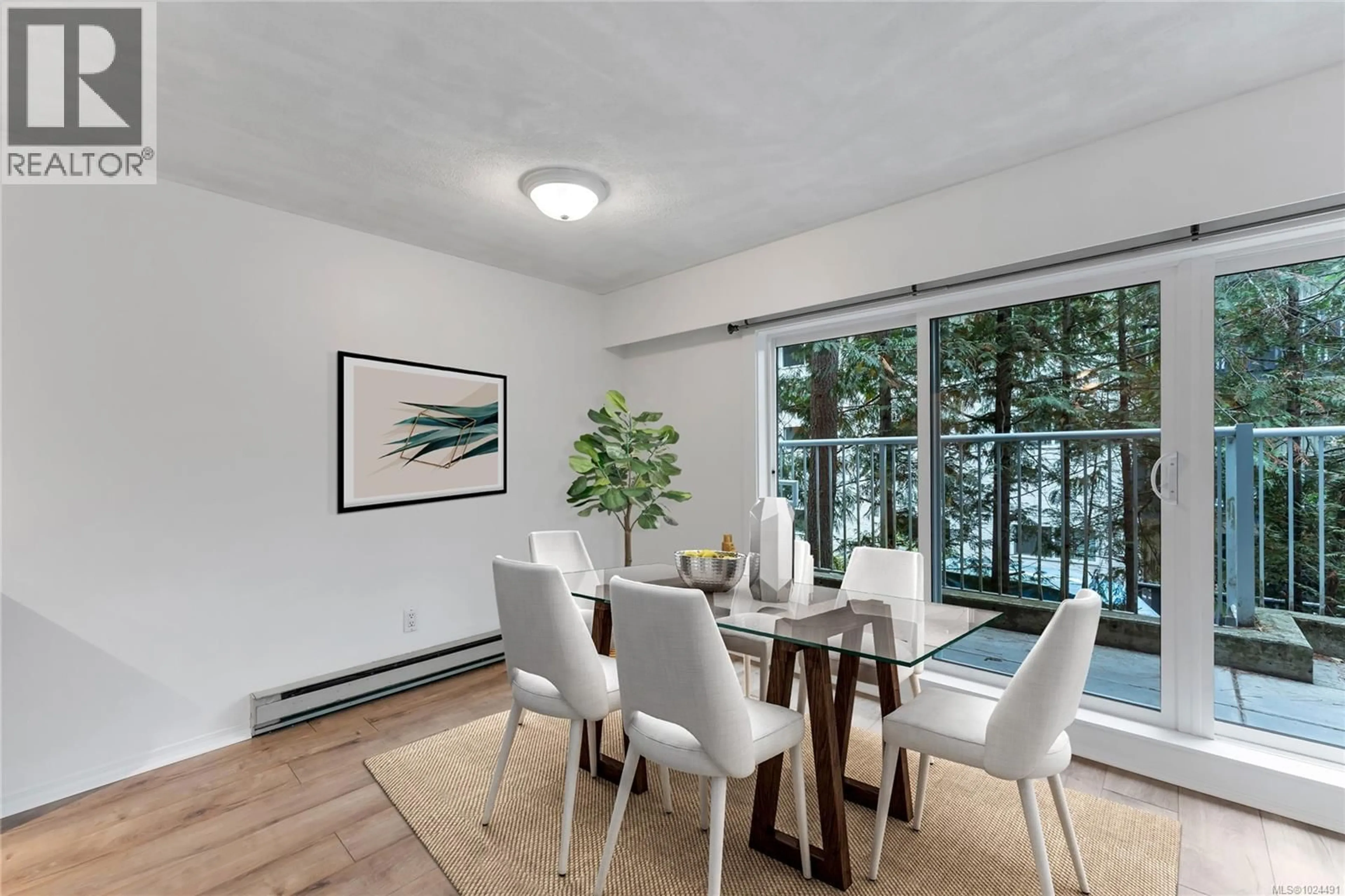 Dining room, wood/laminate floor for 105 - 3277 QUADRA STREET, Saanich British Columbia V8X4W9