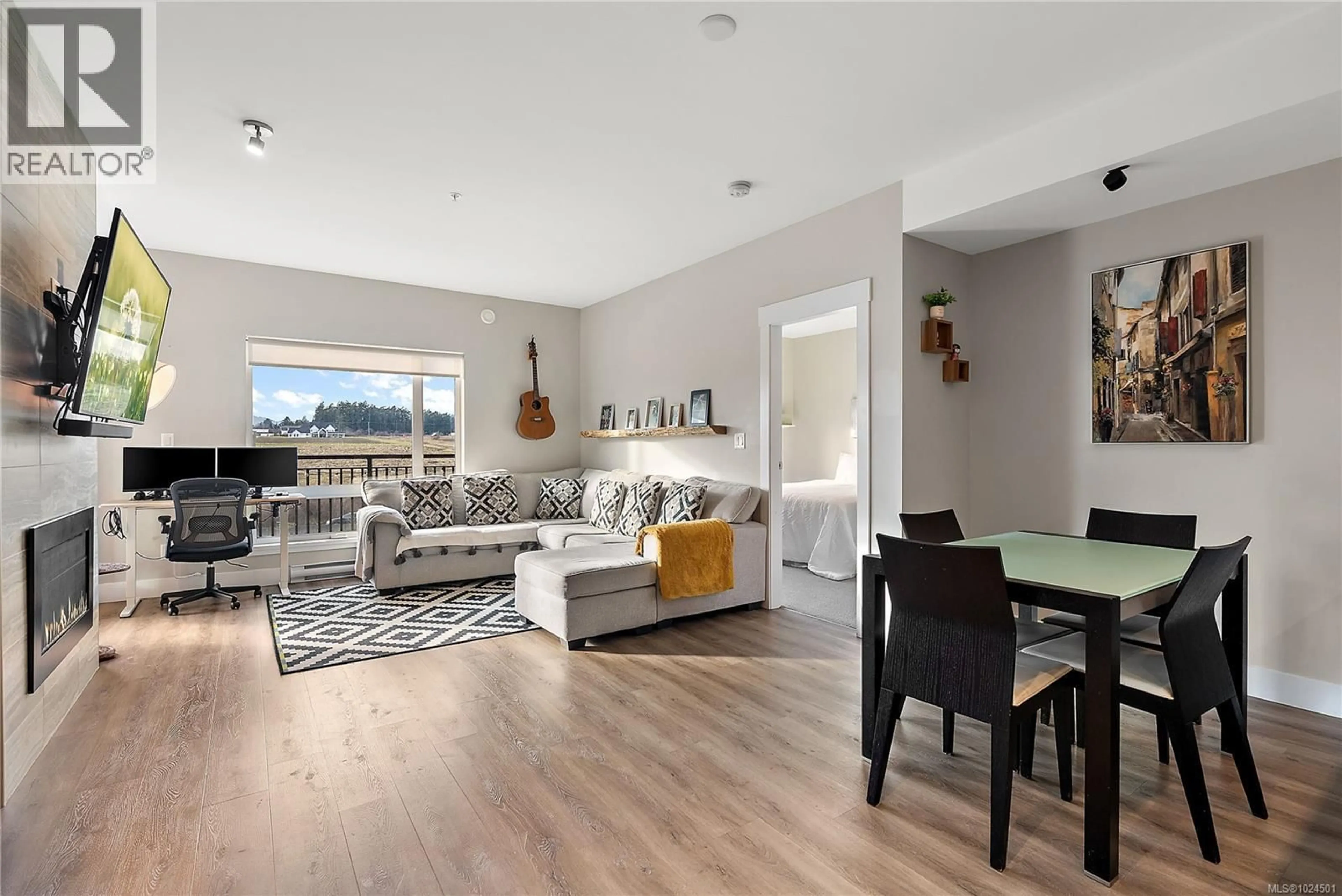 Living room with furniture, wood/laminate floor for 402 - 2500 HACKETT CRESCENT, Central Saanich British Columbia V8M0C1