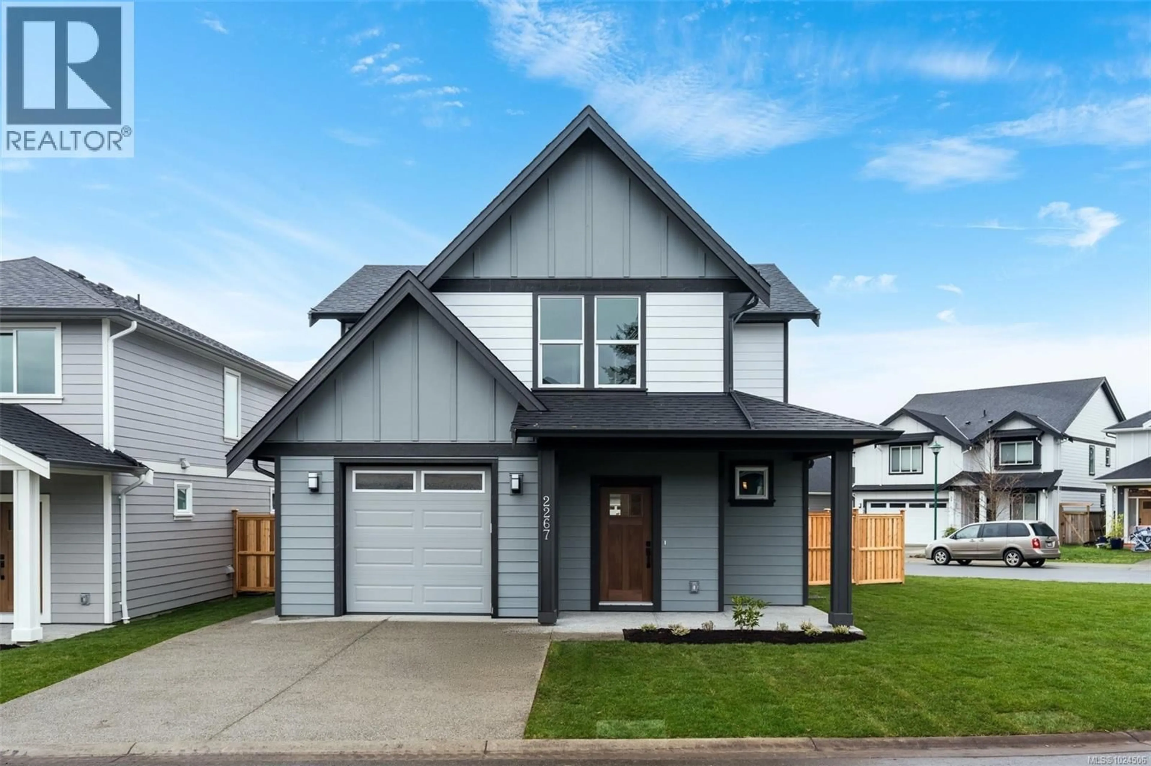 Home with vinyl exterior material, street for 2267 EVELYN LANE, Sooke British Columbia V9Z0W3