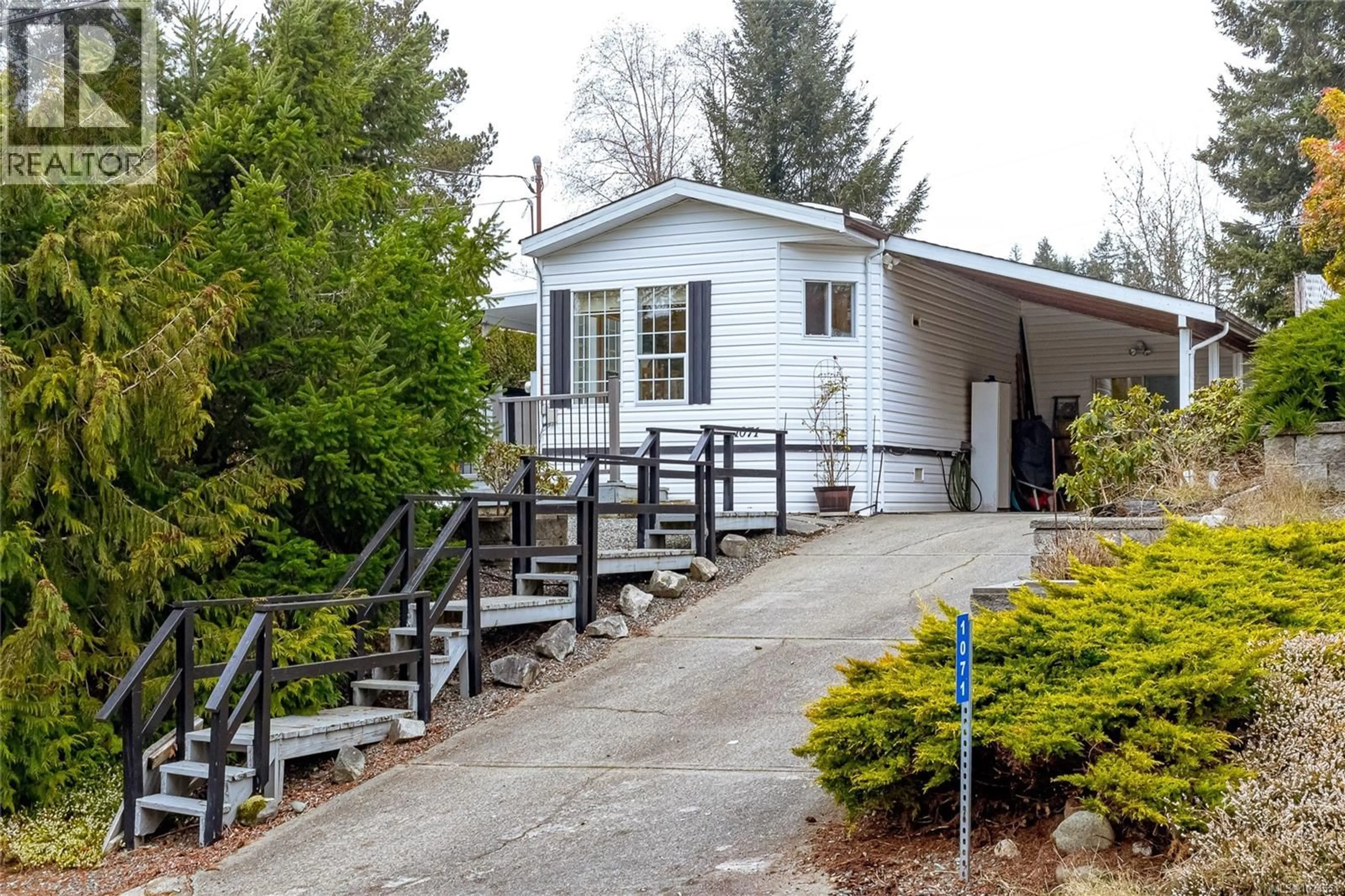 Home with vinyl exterior material, street for 1071 BOURBAN ROAD, Mill Bay British Columbia V0R2P2